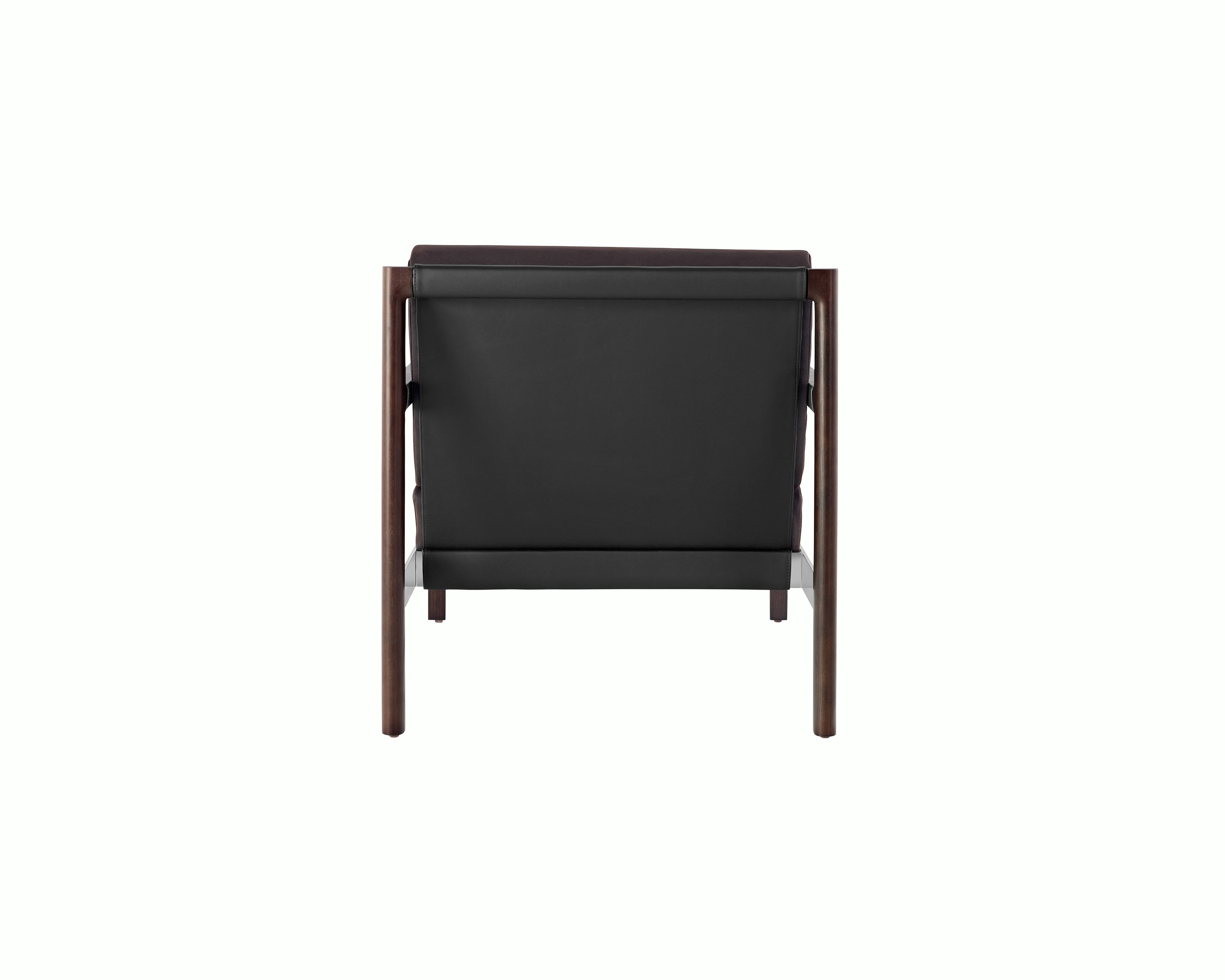 A Brabo club chair with a black leather sling, metal accents, and an exposed wood frame, viewed from behind.