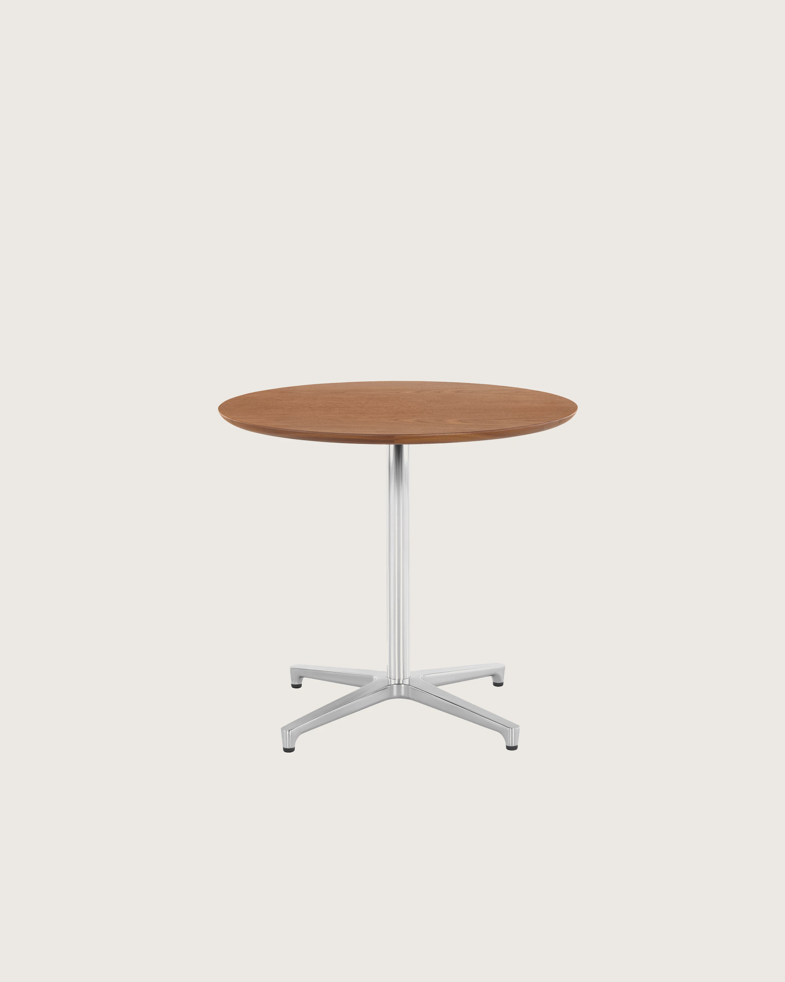 A round Saiba occasional table with a veneer top and aluminum pedestal base.