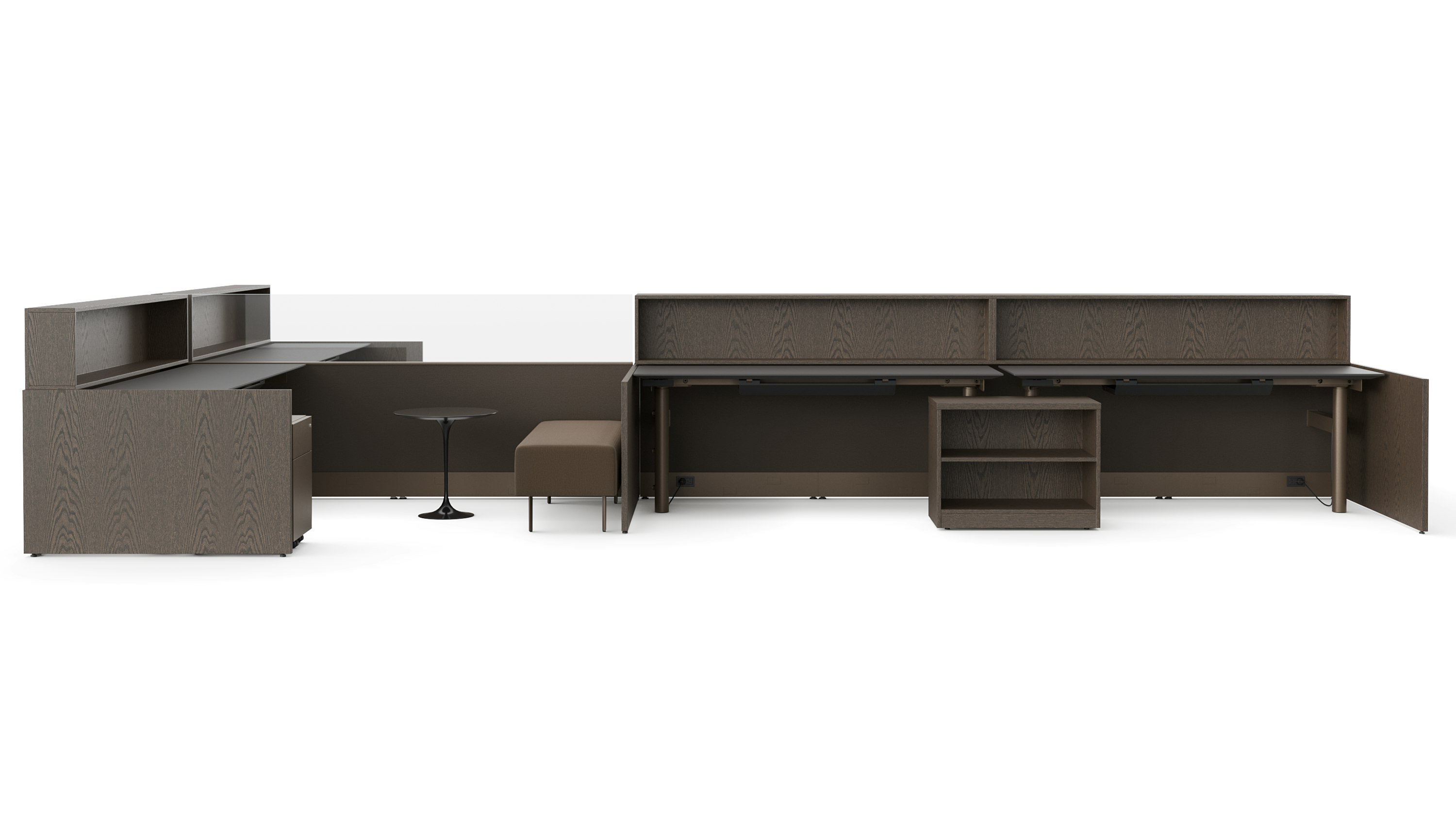 A group of workstations in dark finishes is viewed with several several configurations and accessories like guest benches, personal storage, occasional tables and personal storage.
