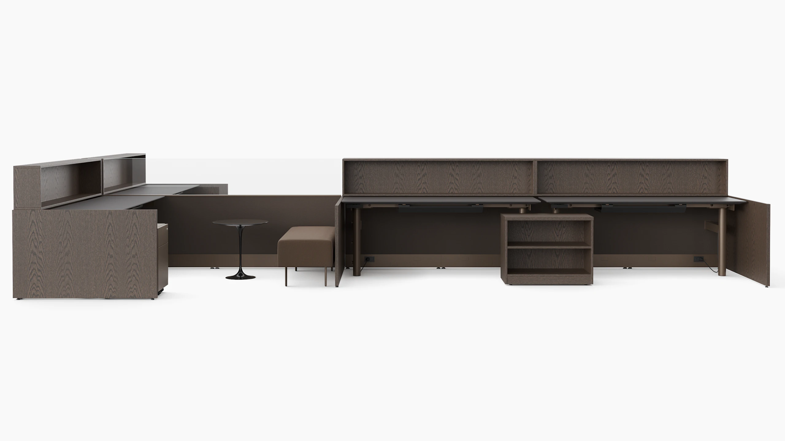 A group of workstations in dark finishes is viewed with several several configurations and accessories like guest benches, personal storage, occasional tables and personal storage.