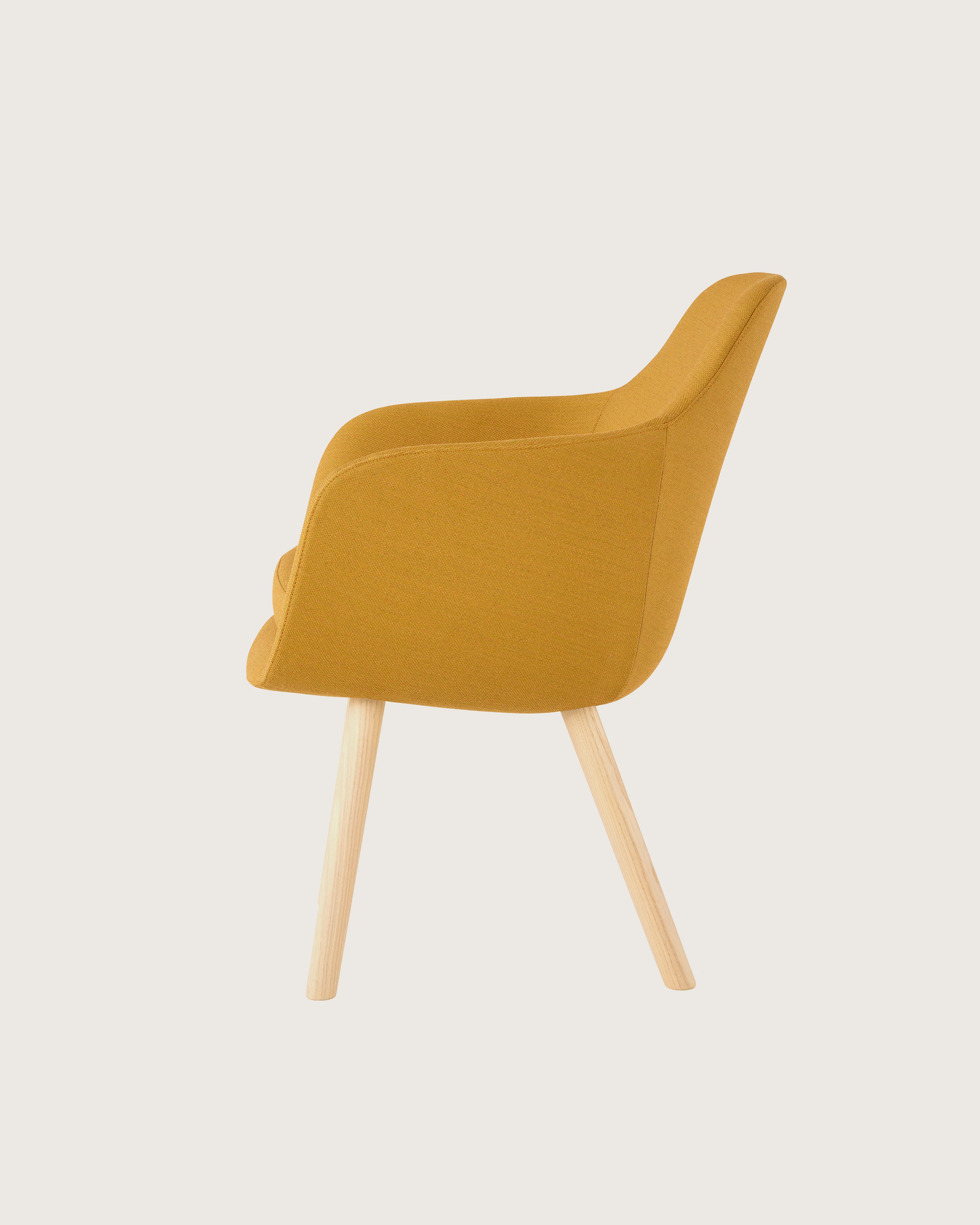 Profile view of a Saiba Side Chair with yellow upholstery and light wood legs.
