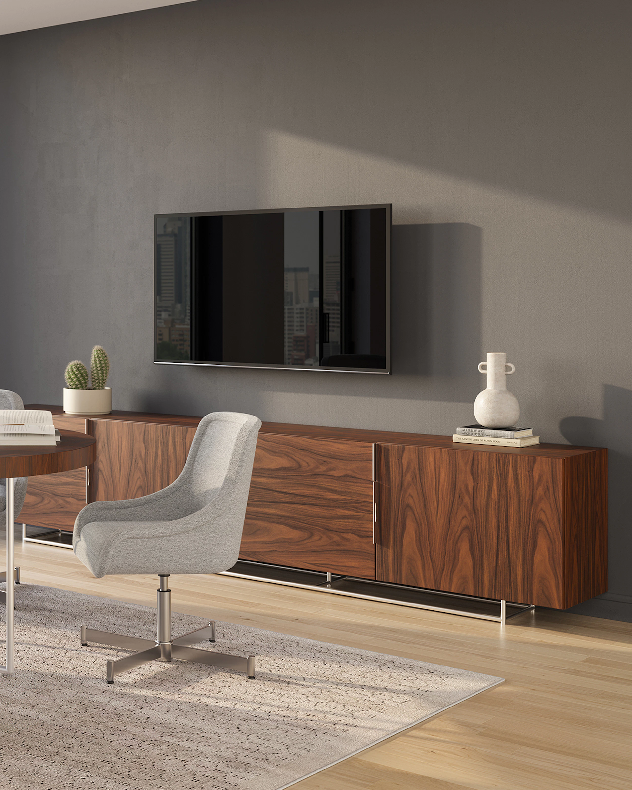 Bumper Side Chair with Low Arms and a four star base in a meeting room environment with a Domino Meeting Table.