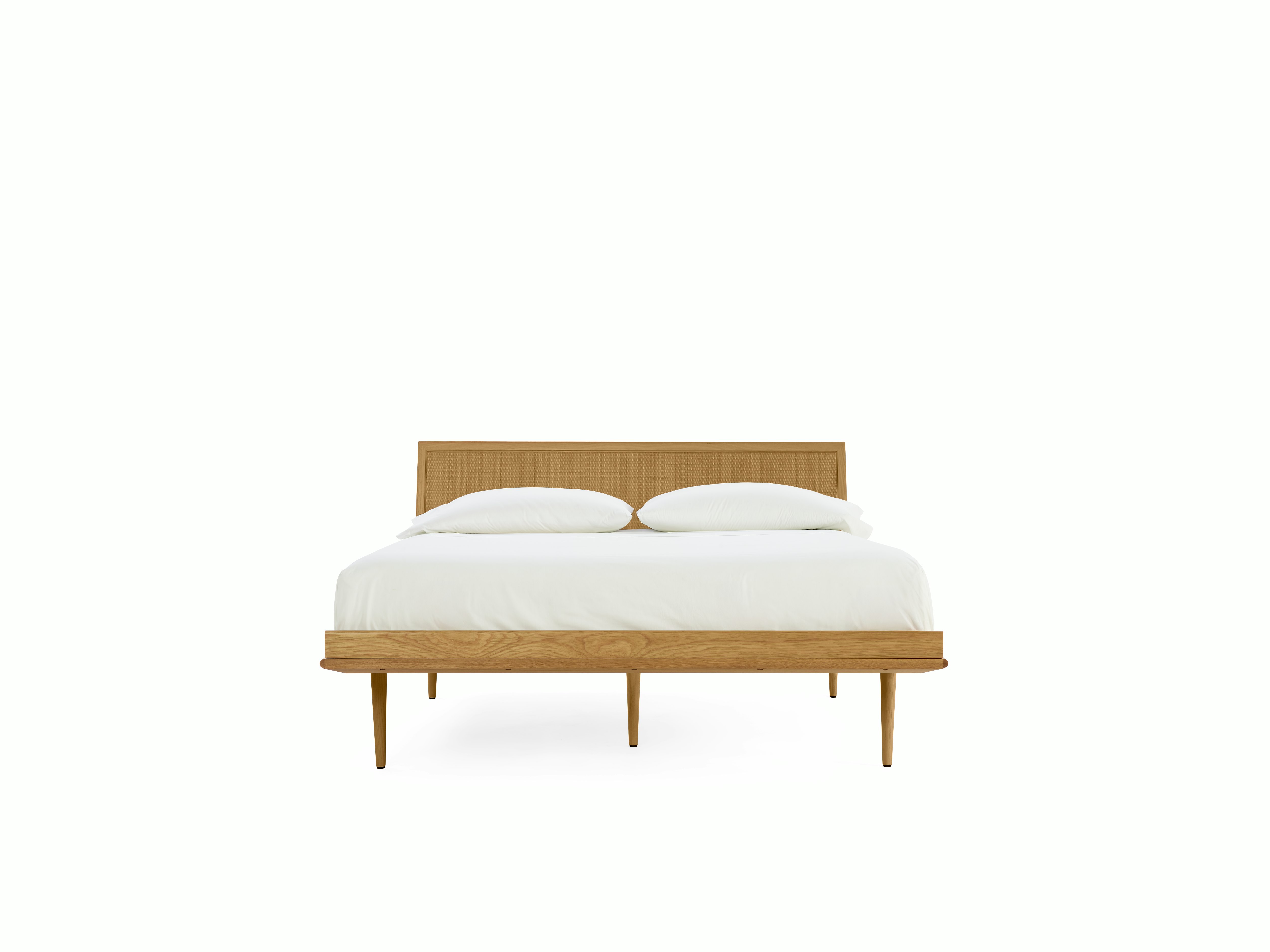 A Nelson Thin Edge Bed in Cane viewed from the front.