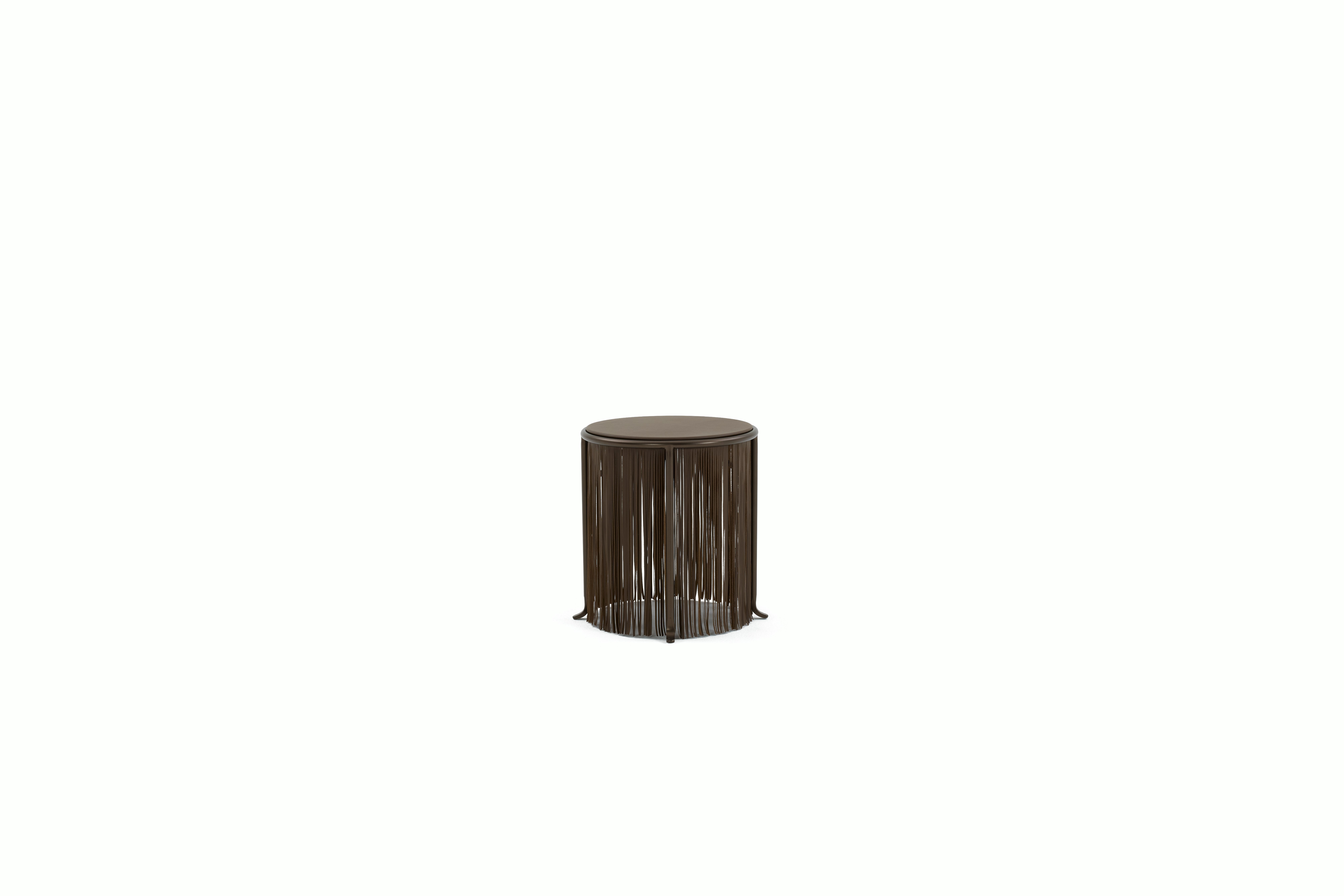 A Dozie Side Table in Bronze viewed from the side.