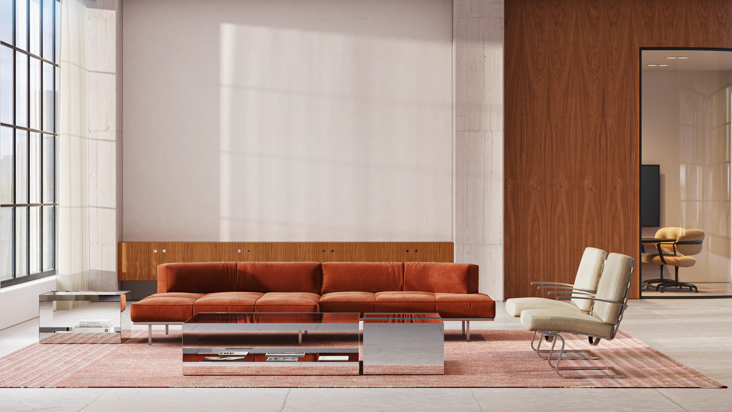 Modern office lounge space with stainless steel D'Urso Occasional Tables, brown Matic Sofa and Tugendhat Chairs.