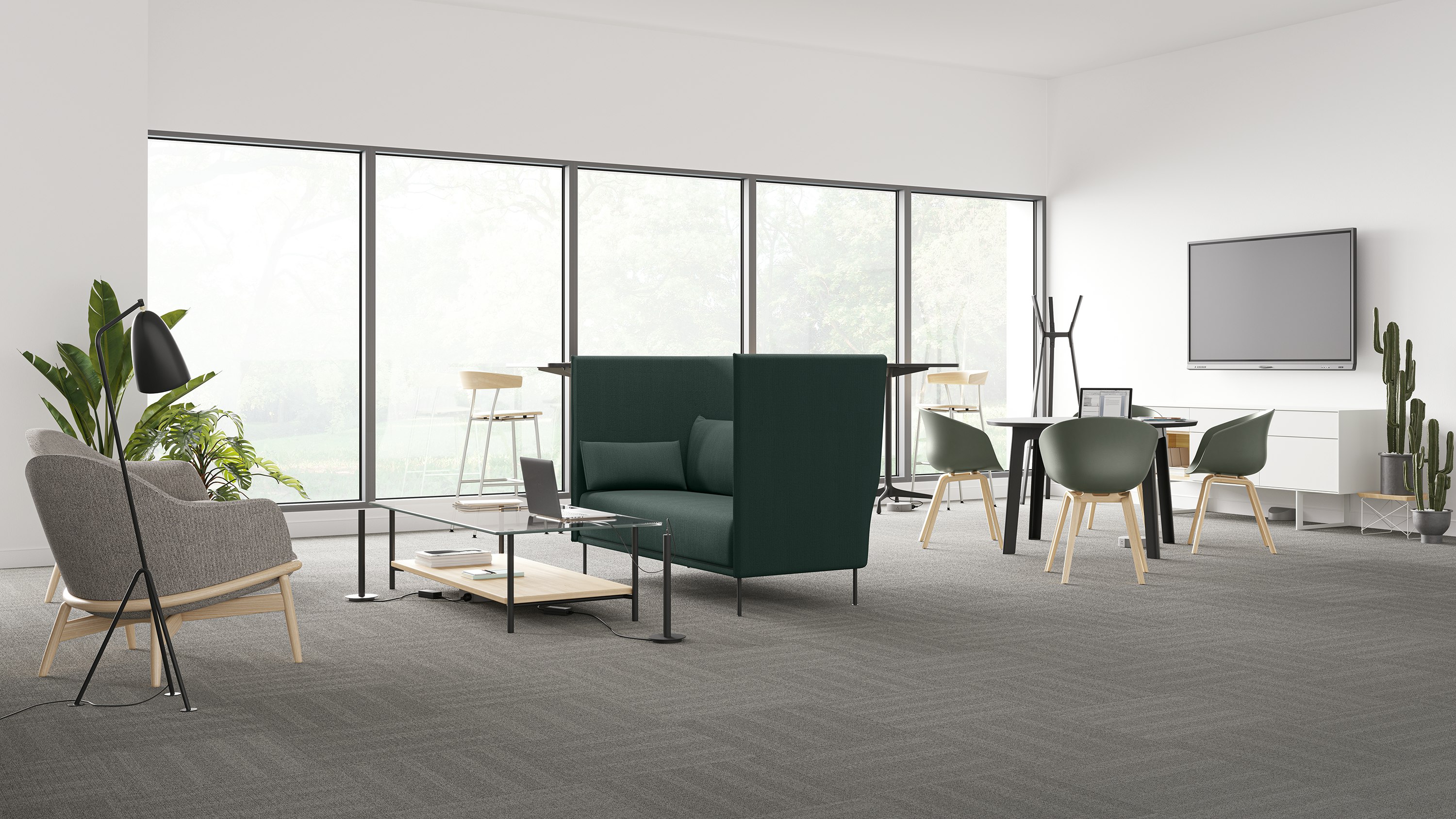 Logic Reach hub and tracks bring power to a grey Reframe Lounge Chair and Layer Table, and a grouping of dark gray Always Chairs.