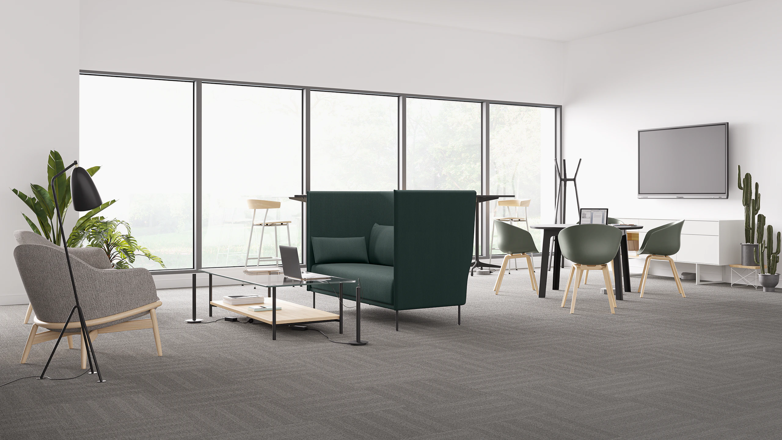 Logic Reach hub and tracks bring power to a grey Reframe Lounge Chair and Layer Table, and a grouping of dark gray Always Chairs.