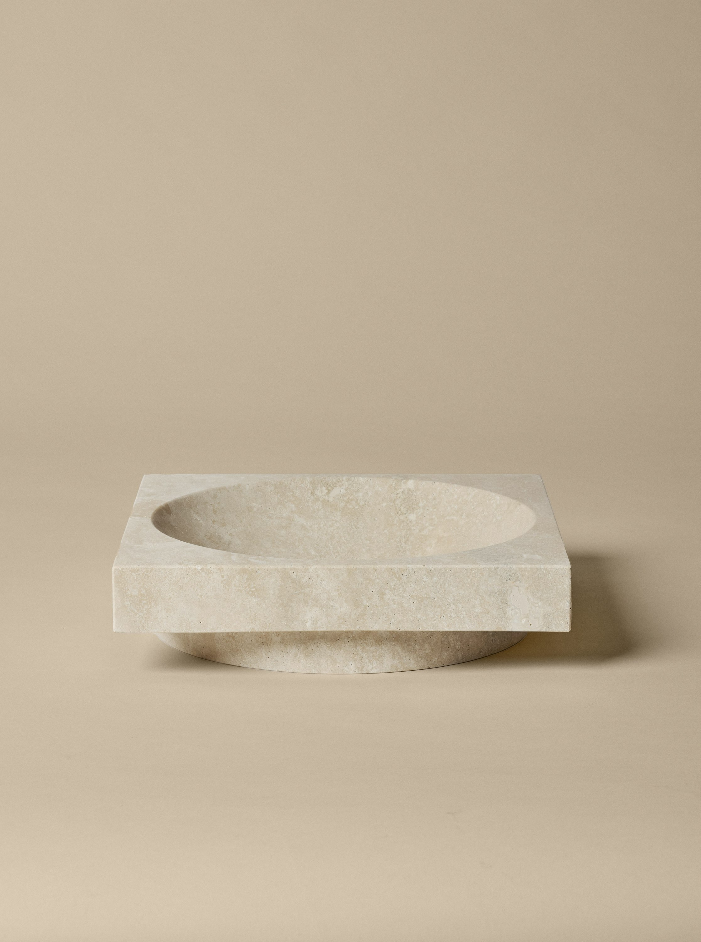 An environmental shot of Hew Travertine Centerpiece.