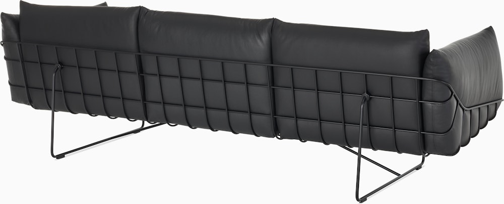 Wireframe Sofa three seater with black leather cushions and black frame.