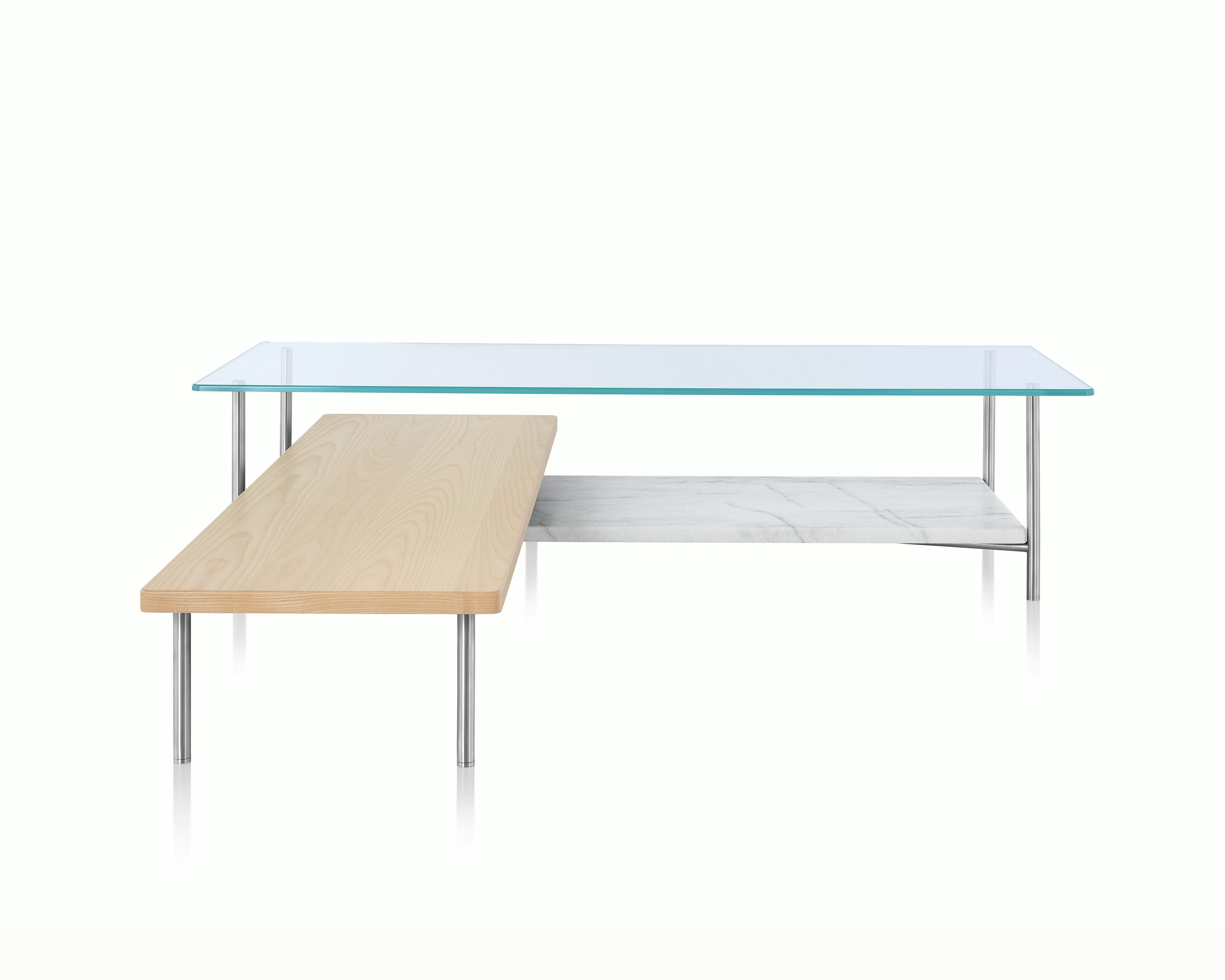 An L-shaped Layer coffee table with a glass top, marble lower shelf, and intersecting wood shelf with a light finish.