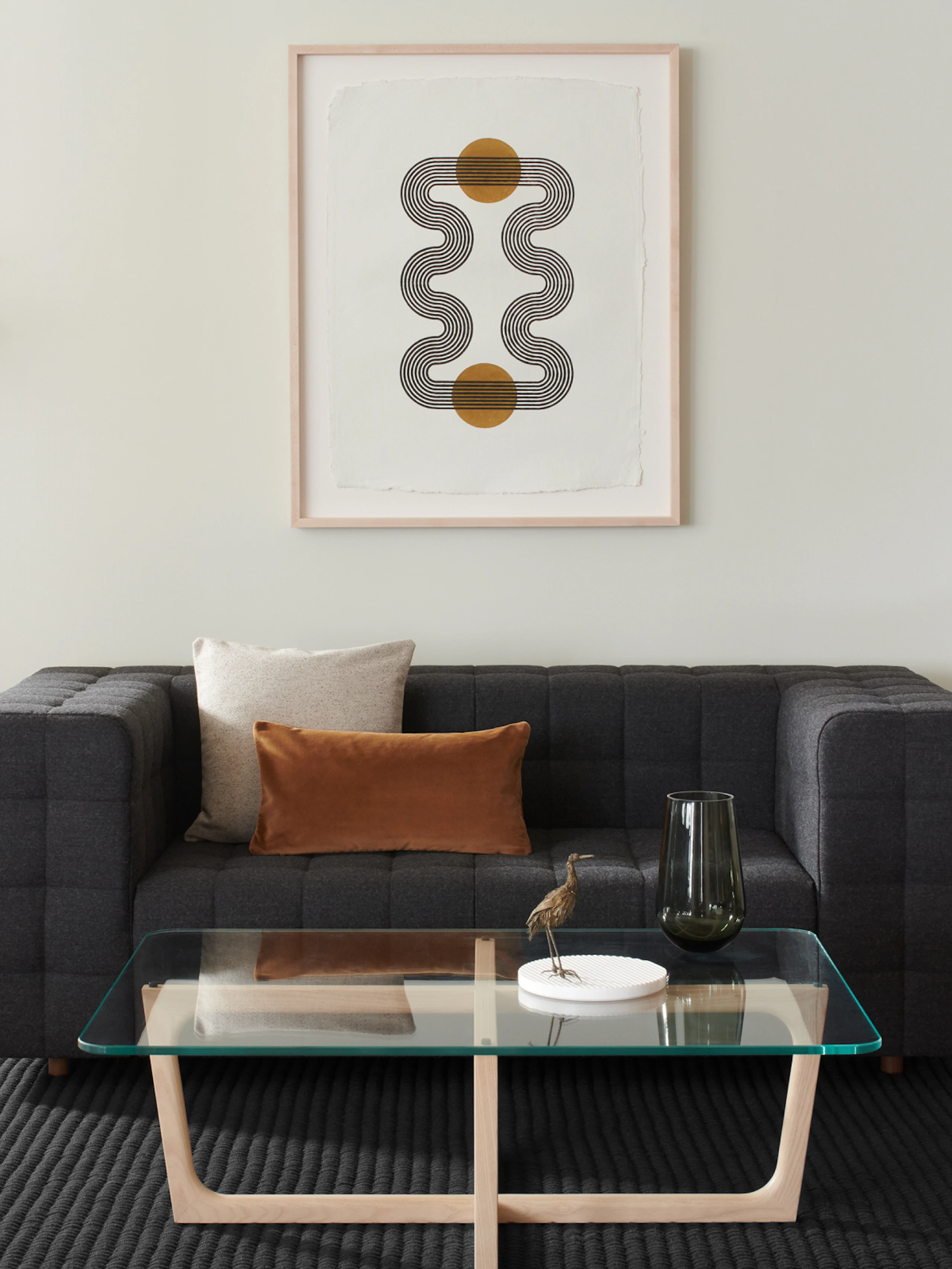 A lounge area featuring a Rapport Settee and Loophole Table.
