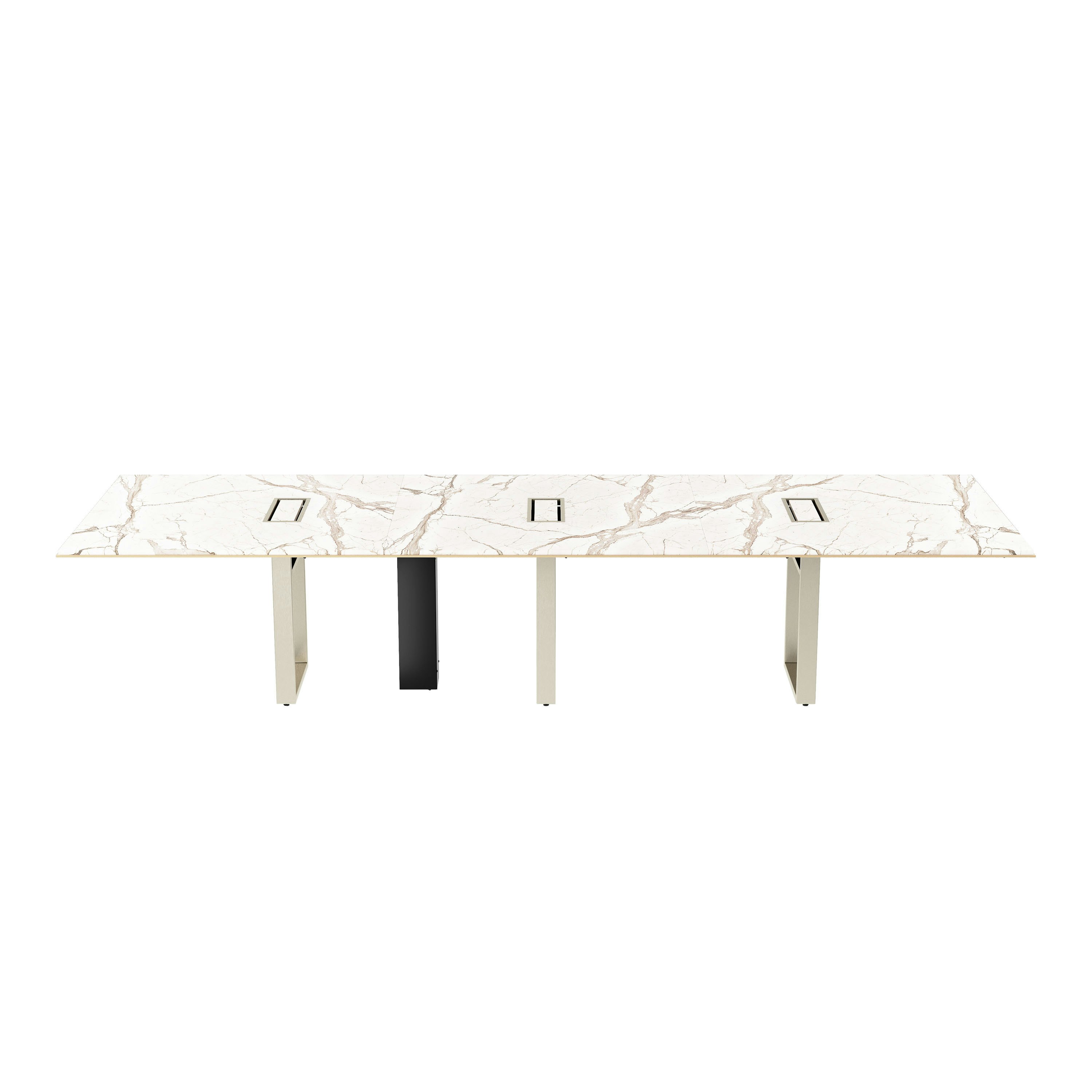 Highline Conference Table in Calacatta Gold Stone with leather edge detail and Satin Nickel base viewed from the front.