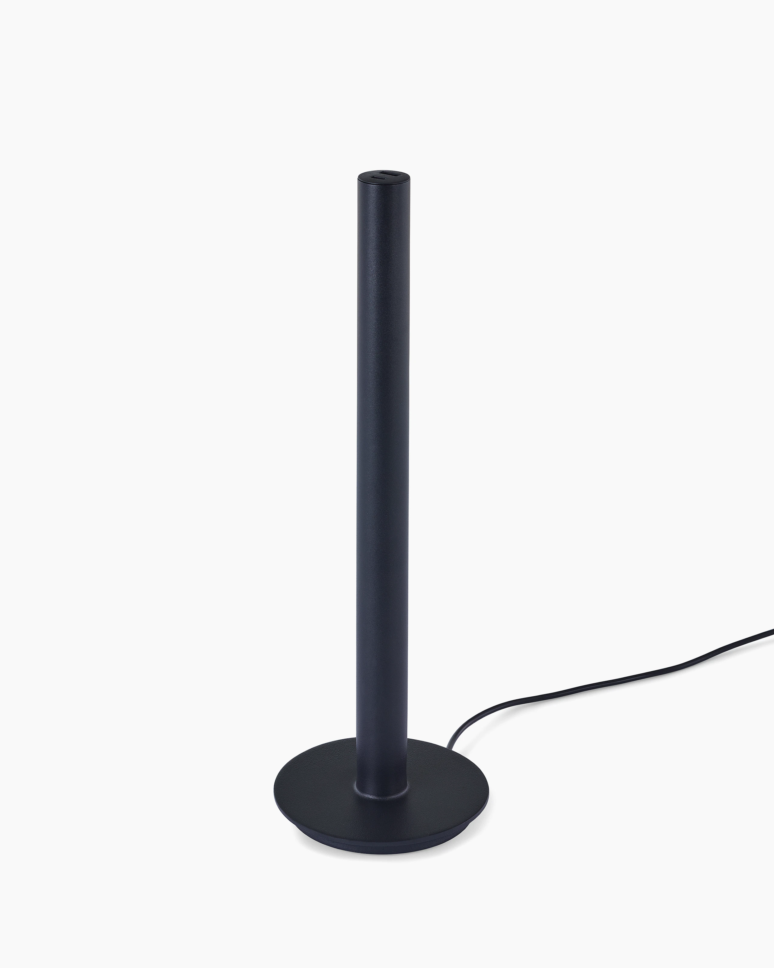 A black Logic Micro Tower with a power cord.