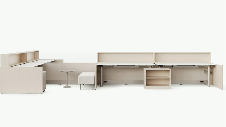Dividends Skyline by Knoll office workstation system with long shared desks, integrated shelving, storage units, and neutral beige finishes.