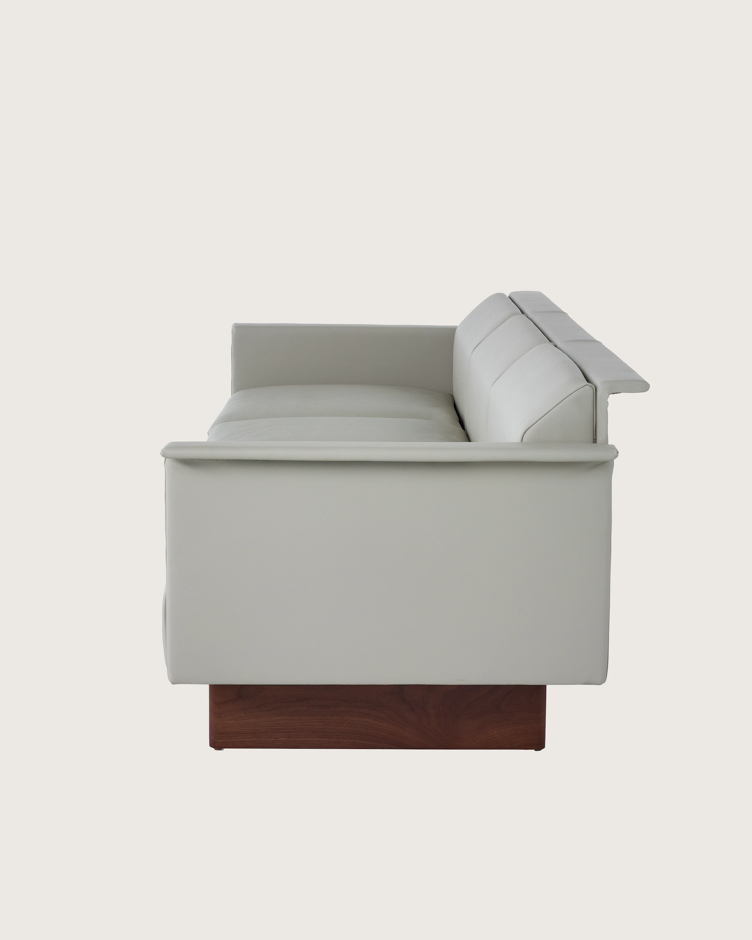 Mantle Three Seater Sofa with Walnut Wood Base in Bristol Leather Ash Gray.