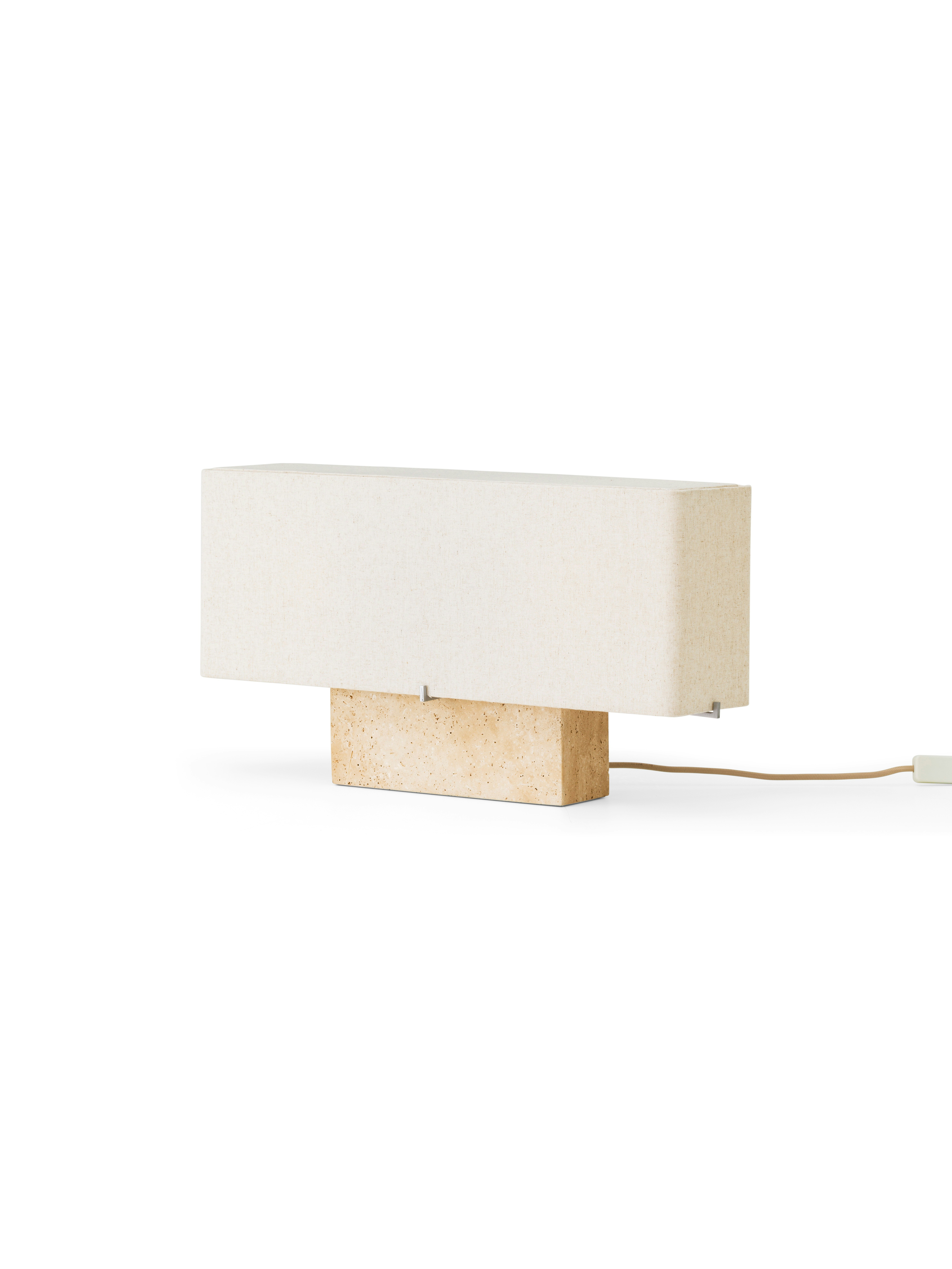 A Nonna Travertine Table Lamp  viewed from the front.