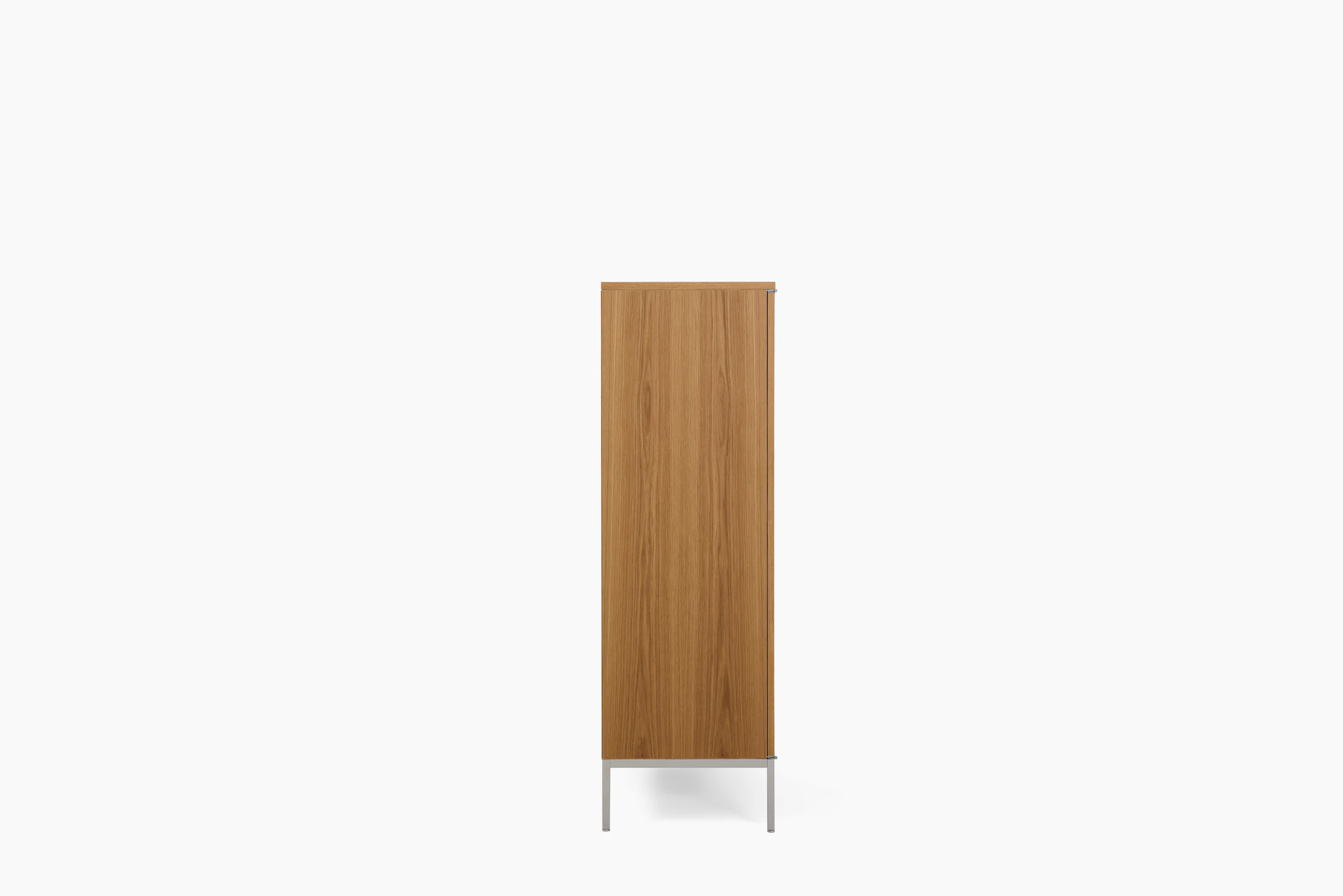 A Knoll Chermayeff Bar Cabinet in Oak viewed from the side.