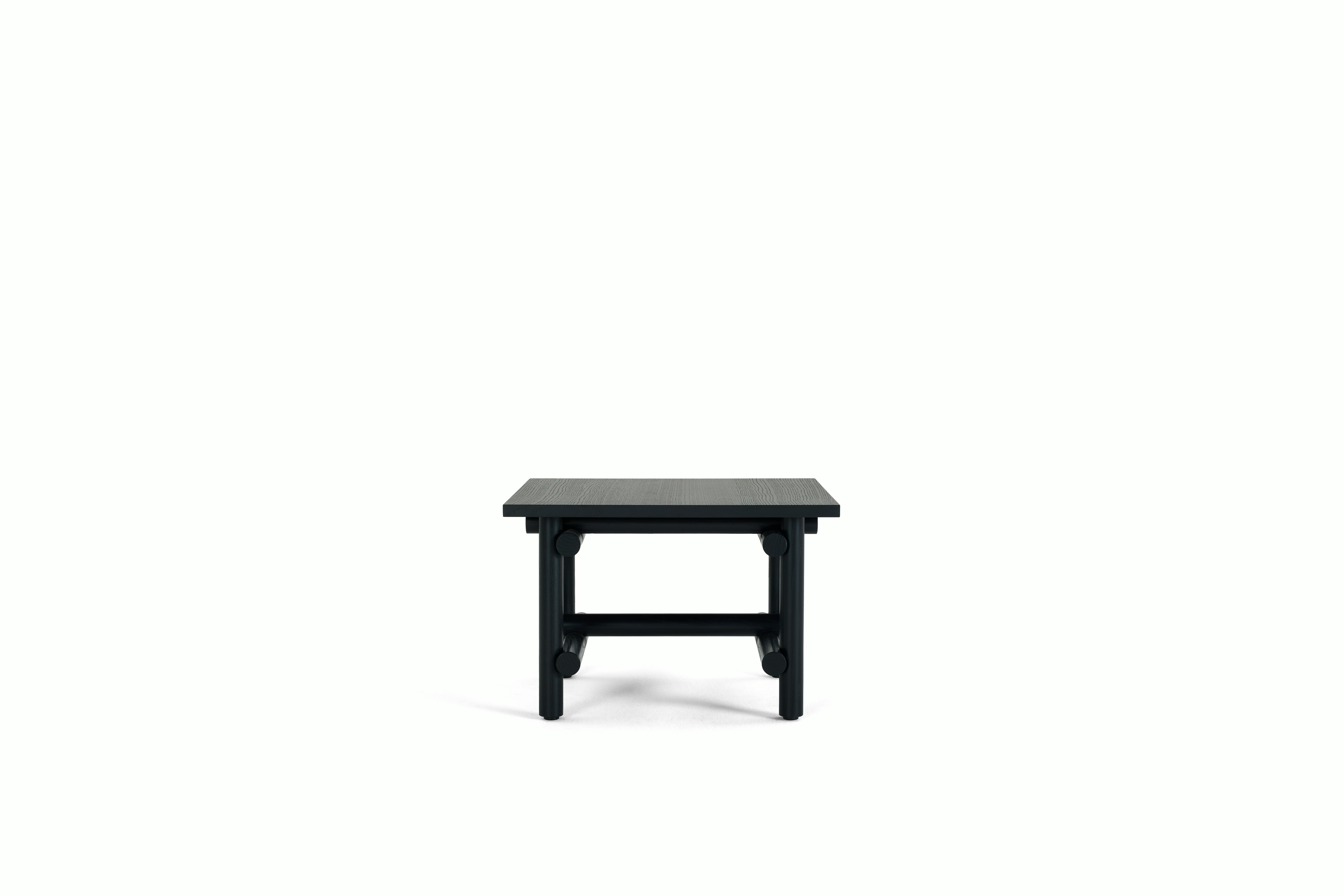 A Muecke Side Table in Ebonized viewed from the side.