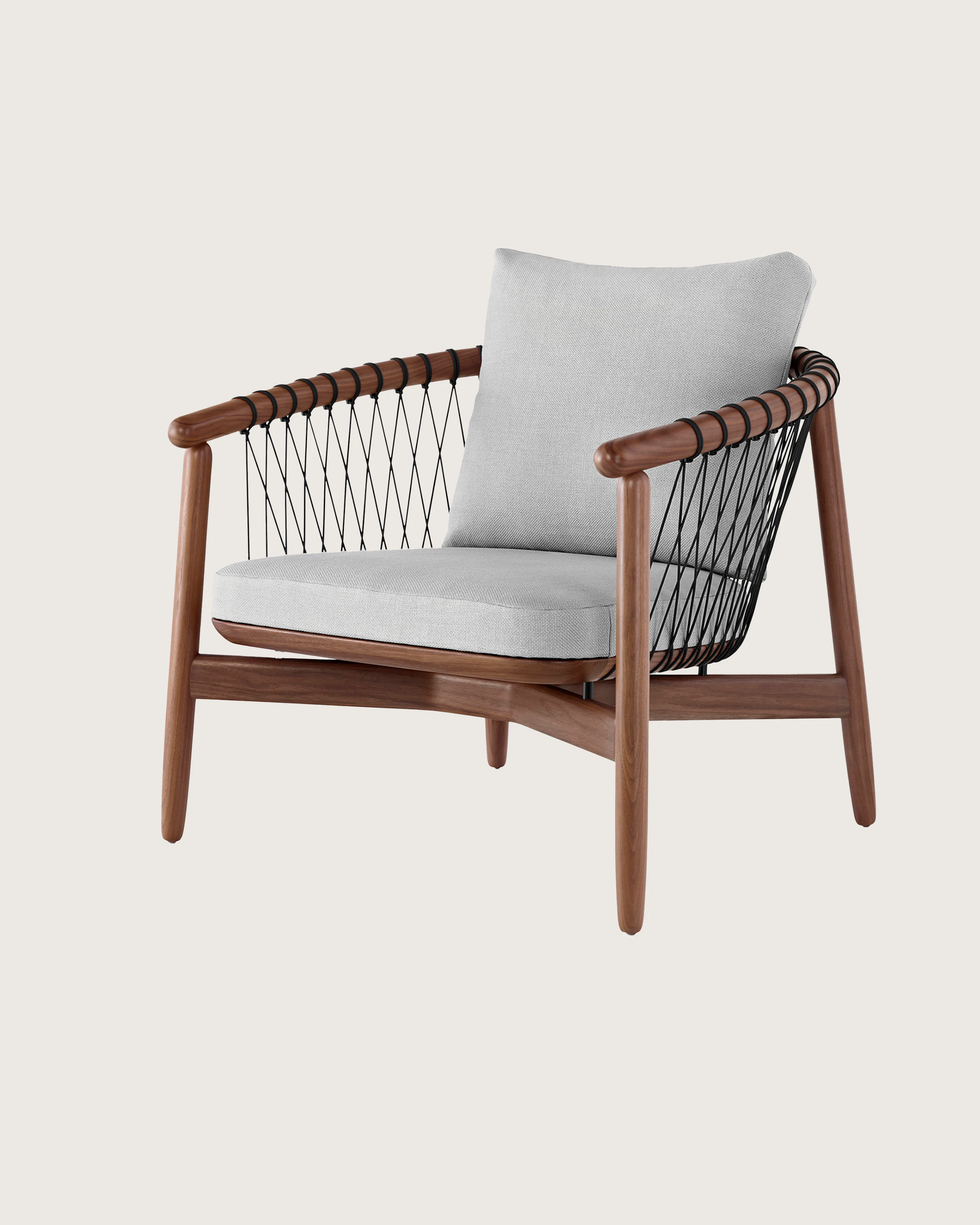 Angled view of a Crosshatch lounge chair with light gray fabric and a wood frame in a medium finish.