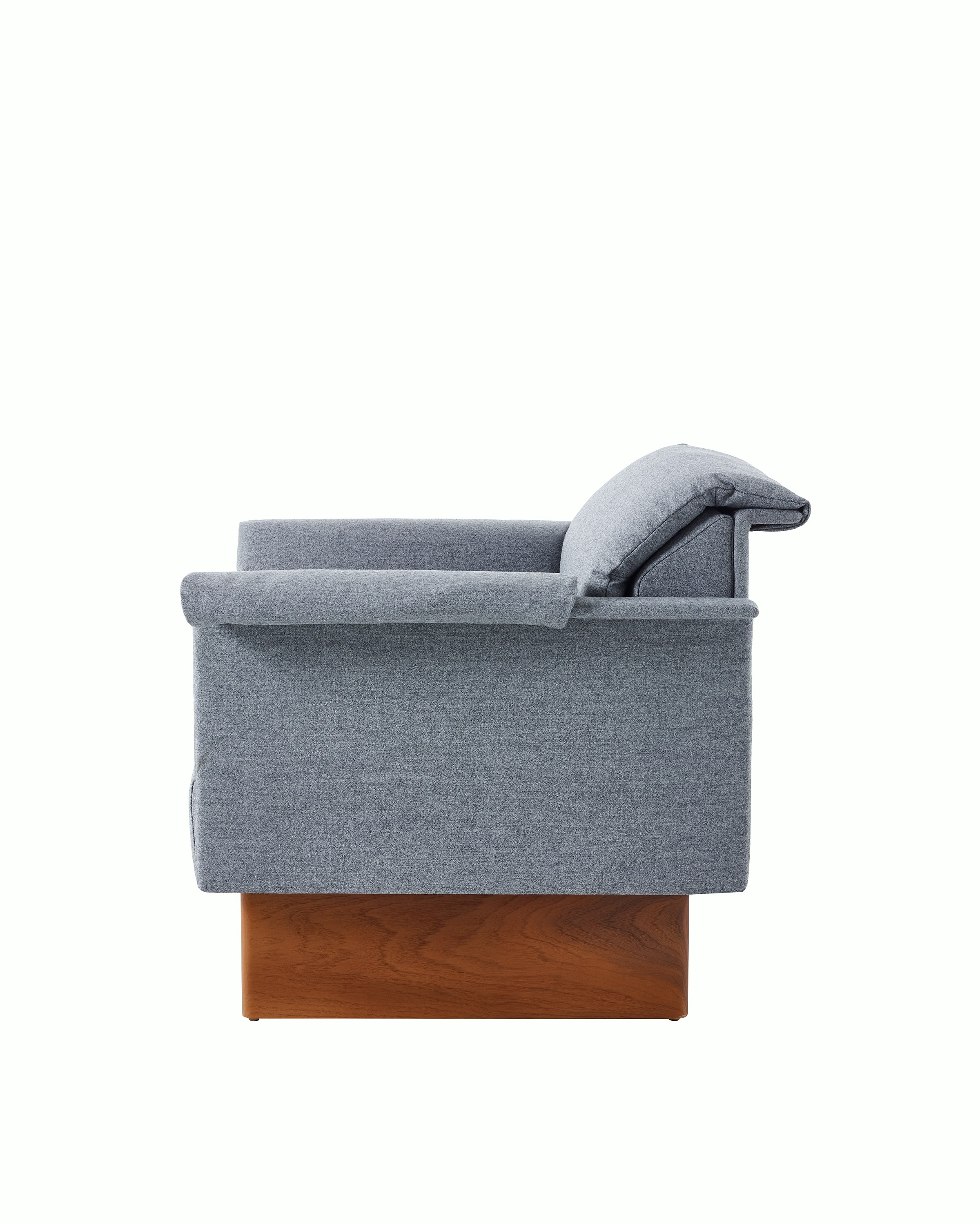 Mantle Club Chair in Panno di Dulce Flannel with a Walnut Base, viewed from the side.