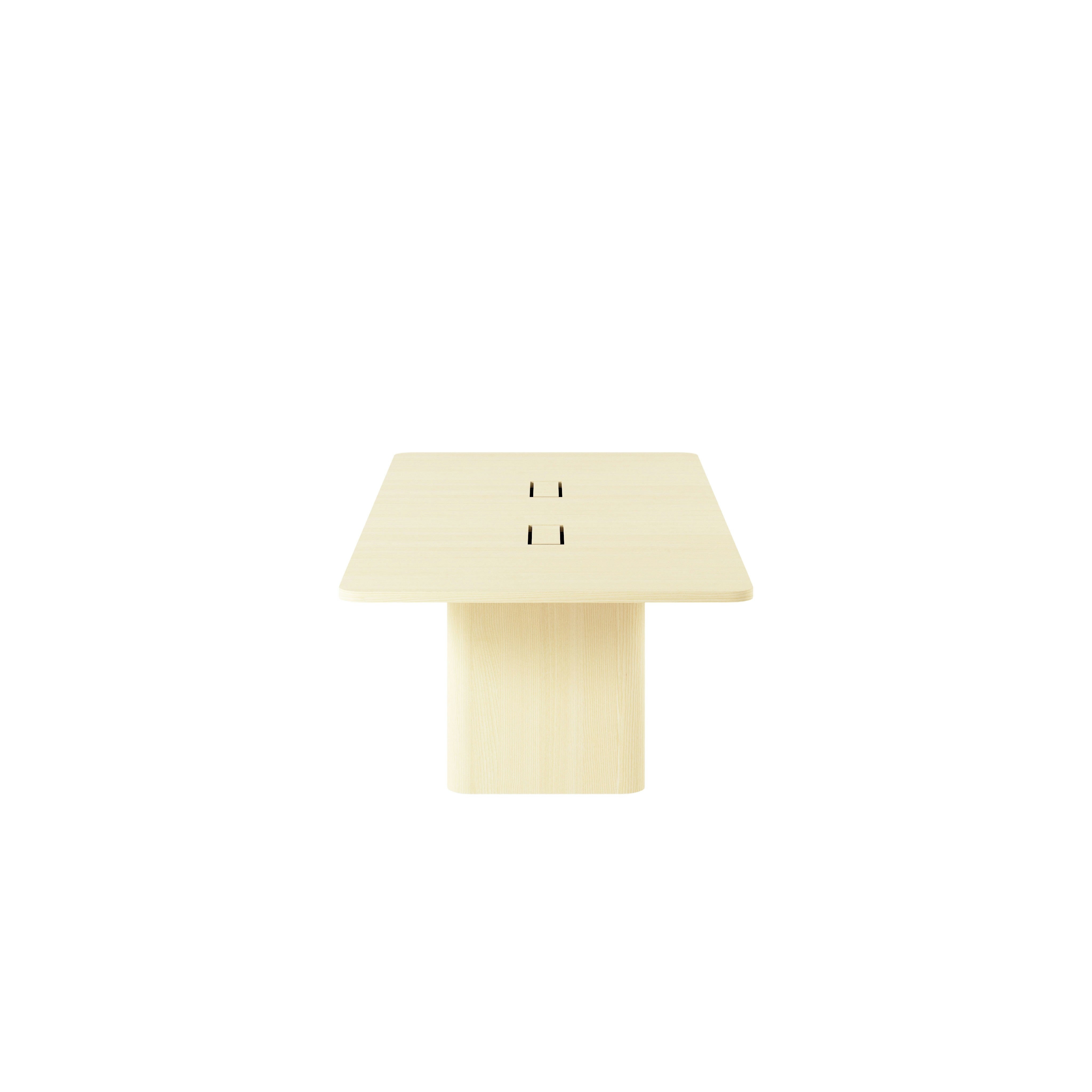 Rectangular JD Conference Table in White Quarter Cut Ash with a 1 and 1/4 inch thick tabletop and racetrack-shaped bases viewed from the side.