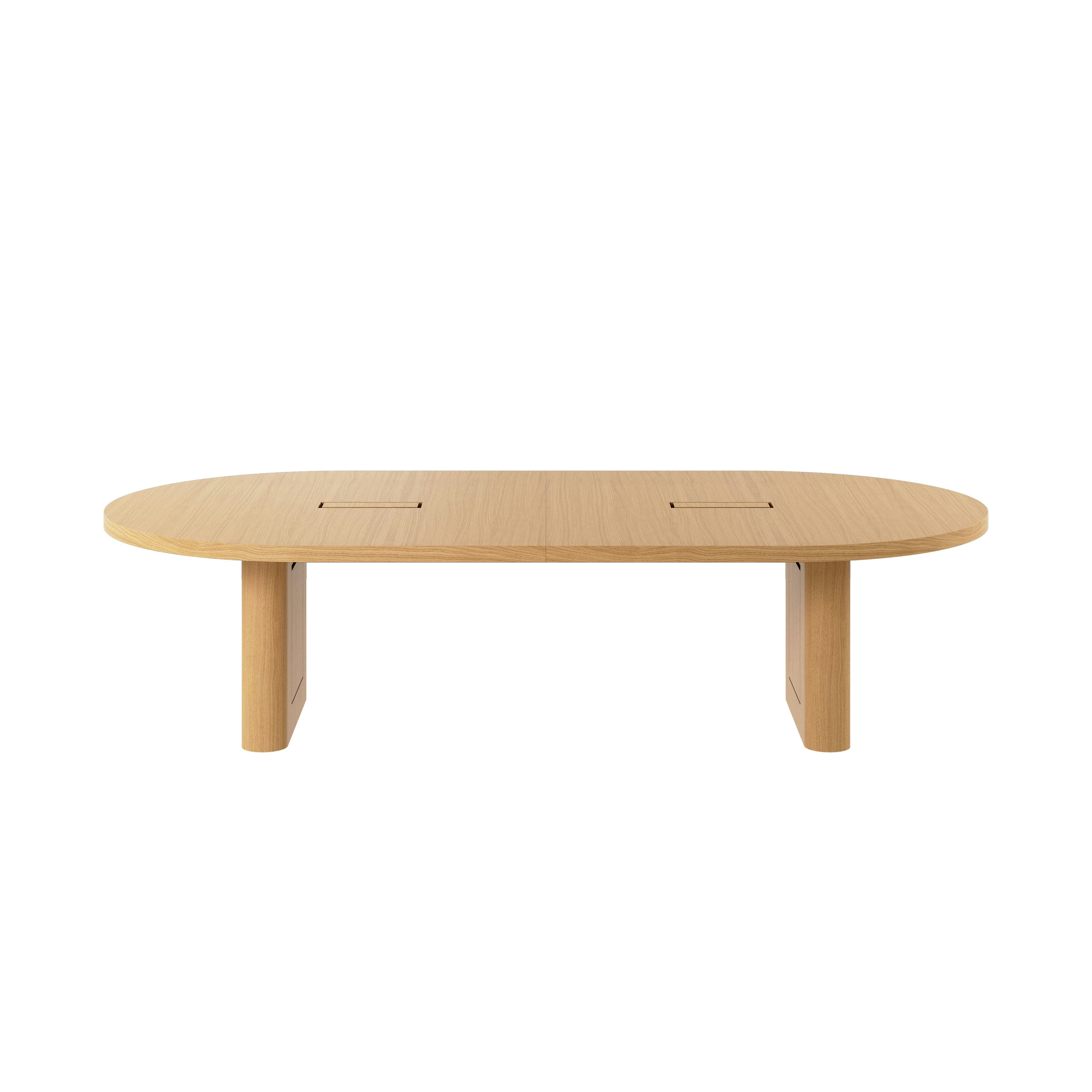Racetrack-shaped JD Conference Table in Natural Rift Cut Oak with a 2 inch thick tabletop and racetrack-shaped bases viewed from the front.