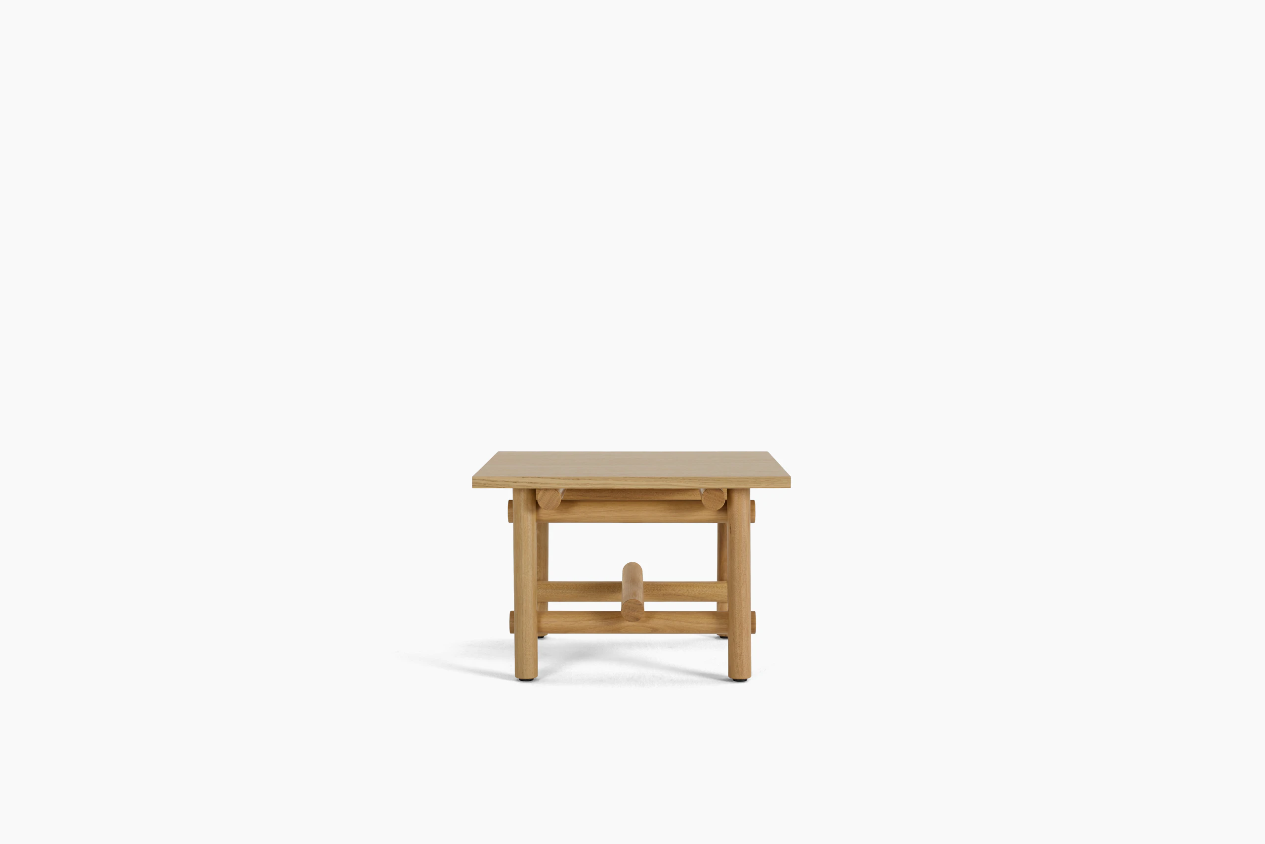 A Muecke Side Table in White Oak viewed from the side.