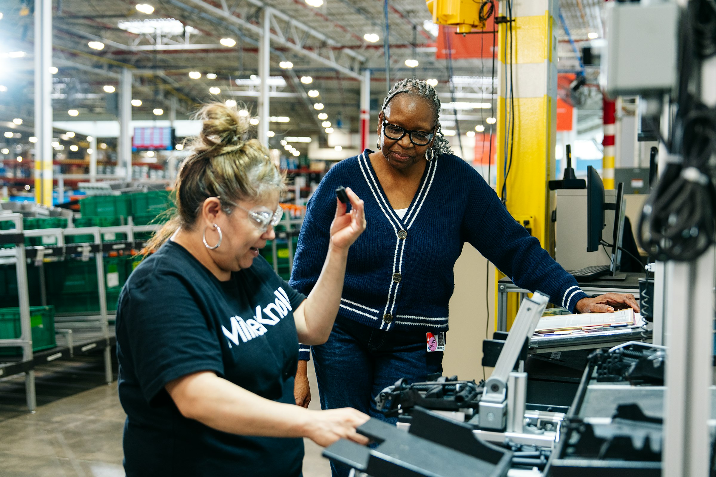 Two people working together in a warehouse facility.