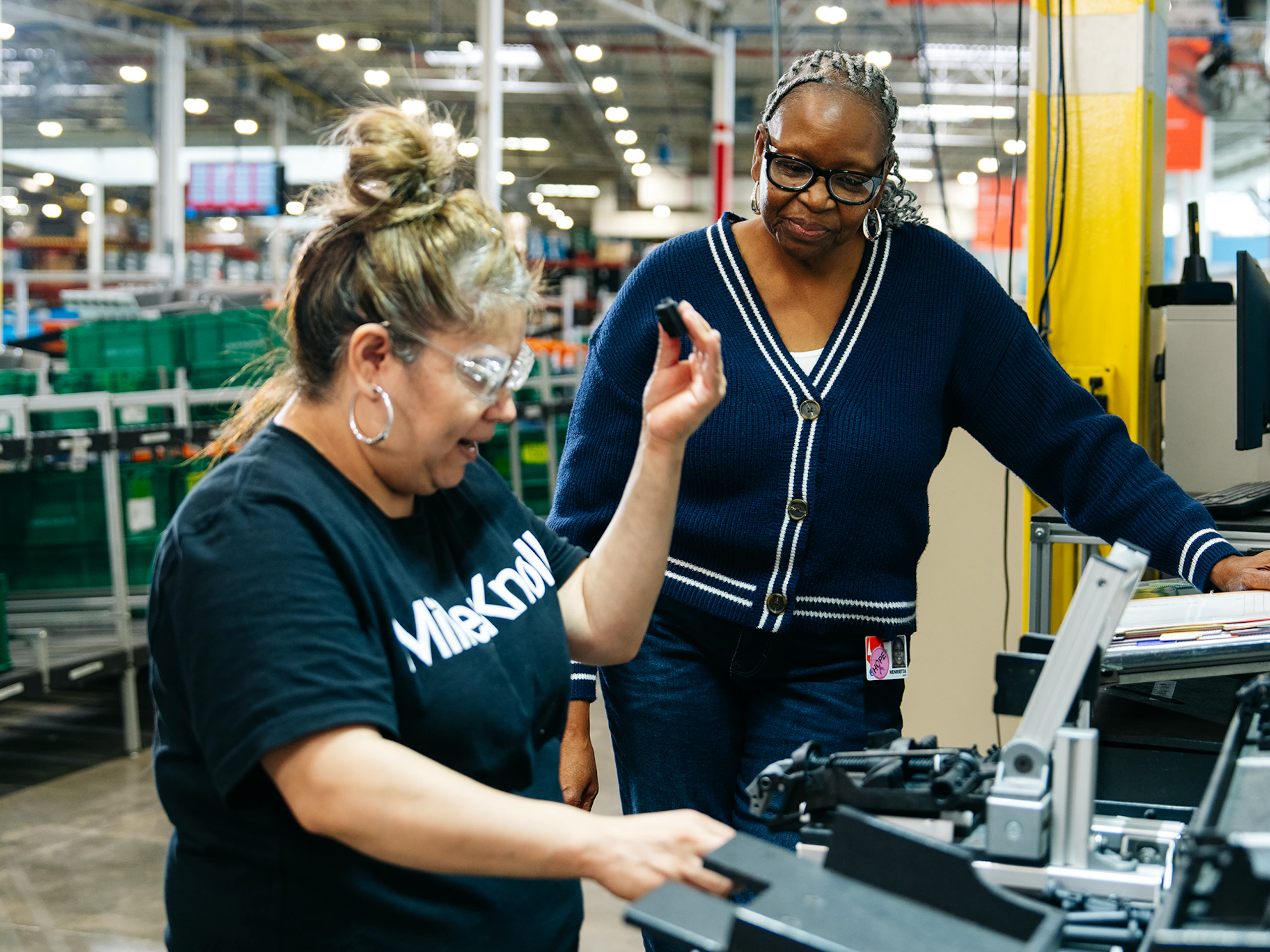 Two people working together in a warehouse facility.