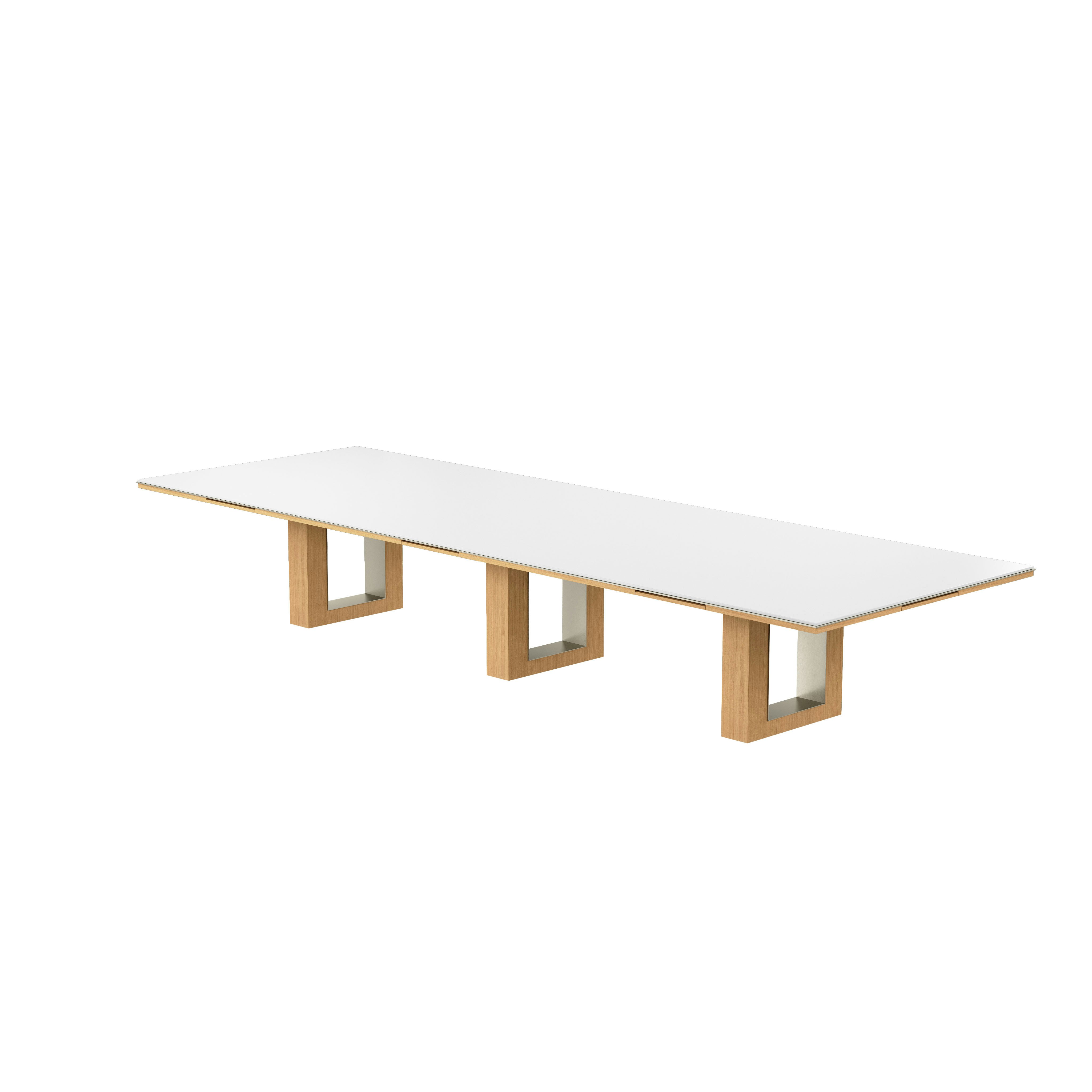 Rectangular Highline Fifty Conference Table in Glacier White Corian and Natural Rift Cut Oak with a Satin Nickel edge and base trim viewed from an angle.