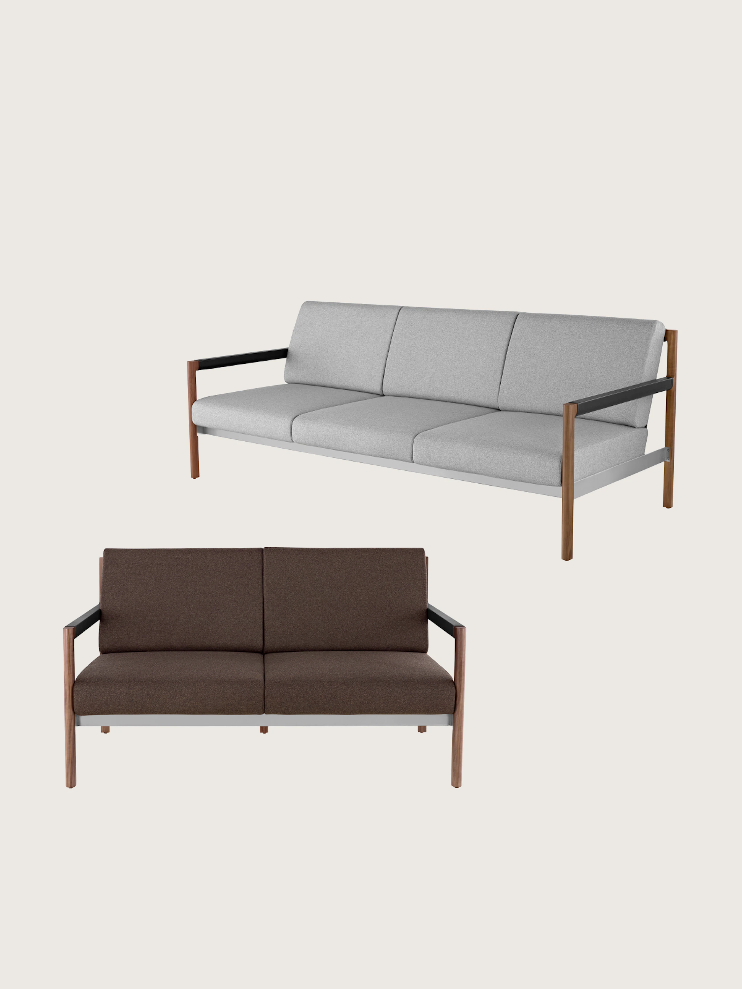 Two Brabo Sofas designed by Vincent Van Duysen, one front-facing settee with a wood frame and dark wood upholstery, one three-seater sofa with a wood frame and grey upholstery shown at an angle and staggered above the other, on a white sweep.