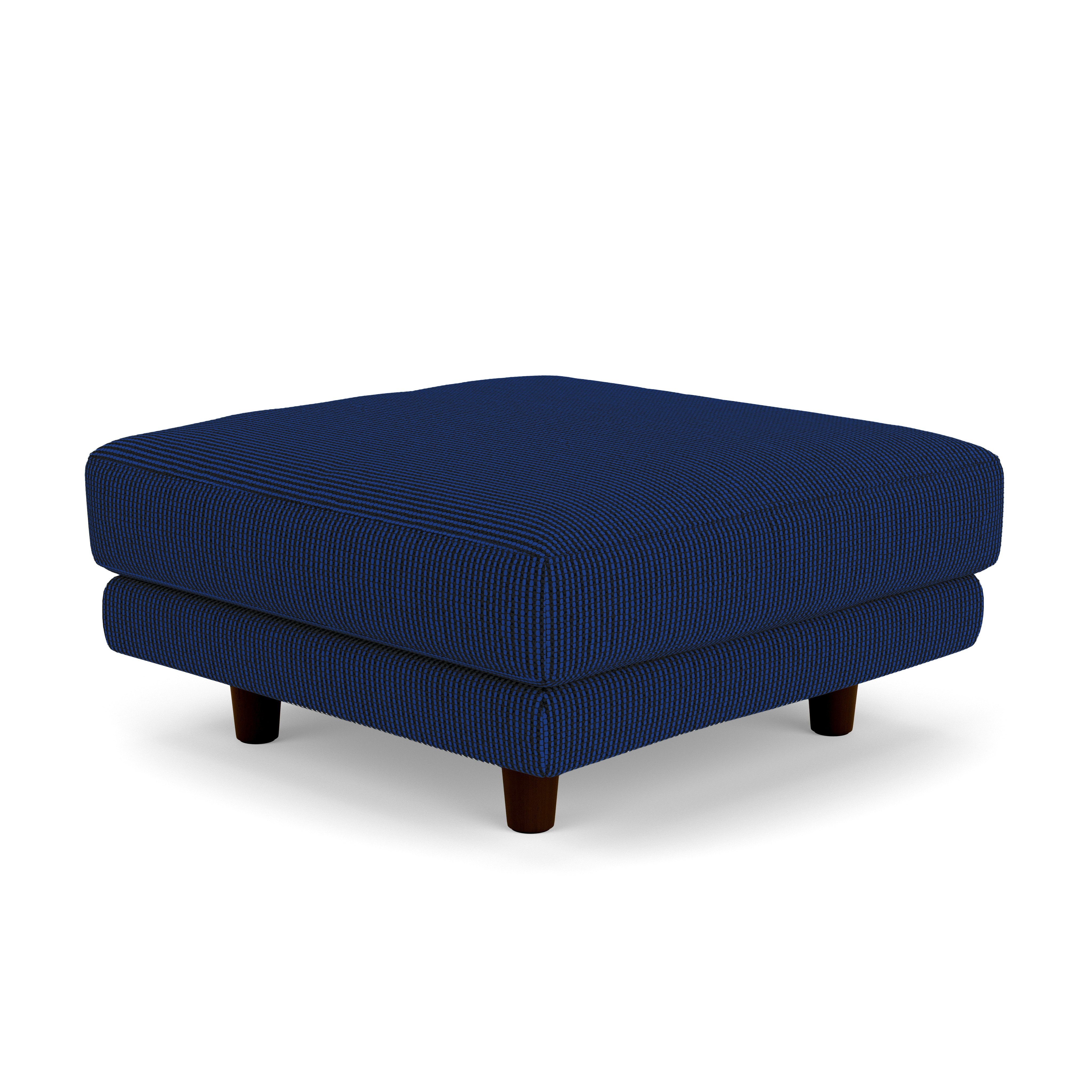 A D'Urso Ottoman in Lazuli Burnt Walnut on Oak viewed from an angle.