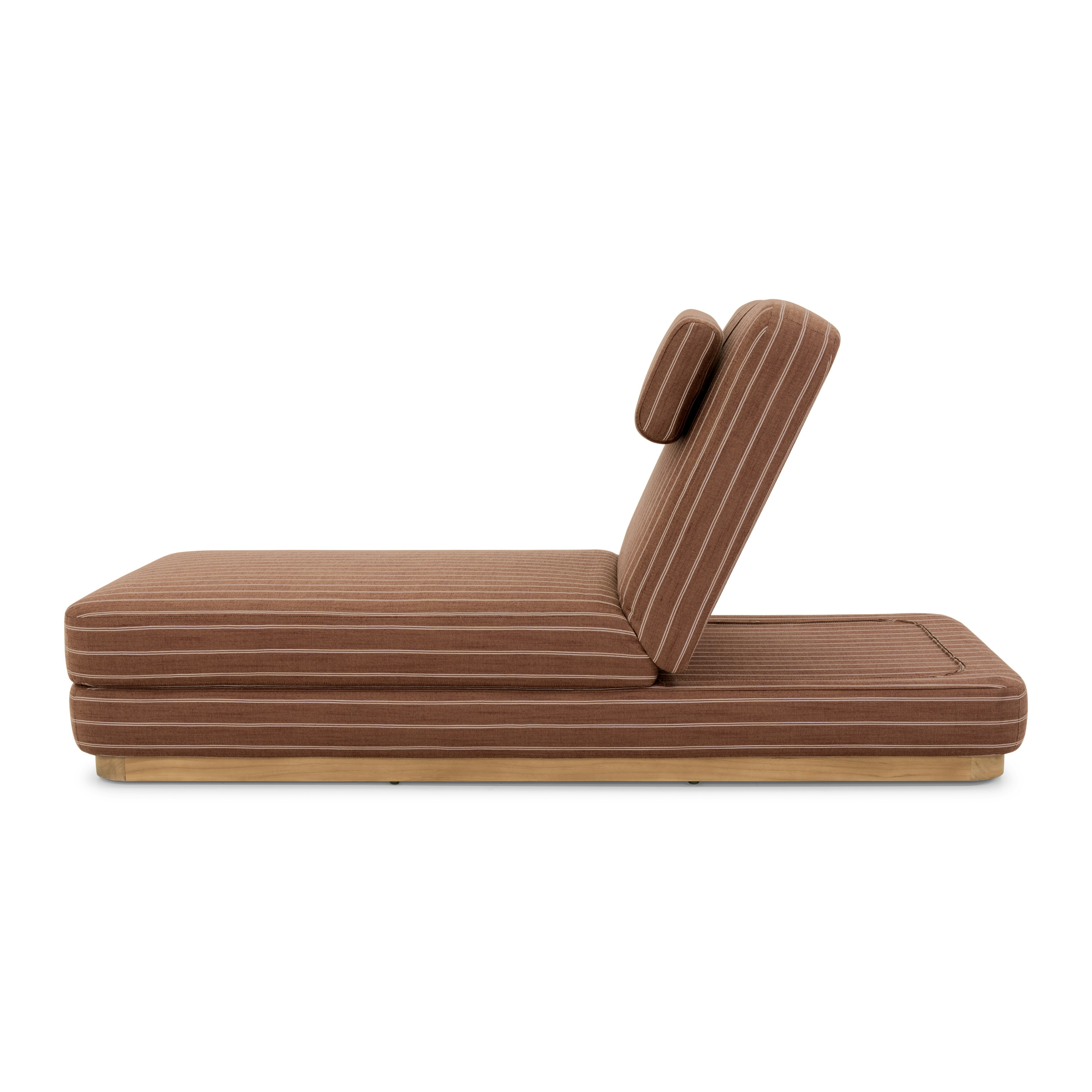 A Stack Outdoor Chaise in Terra Rossa viewed from the side.