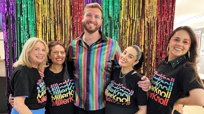 Five people celebrating Pride at a MillerKnoll event.