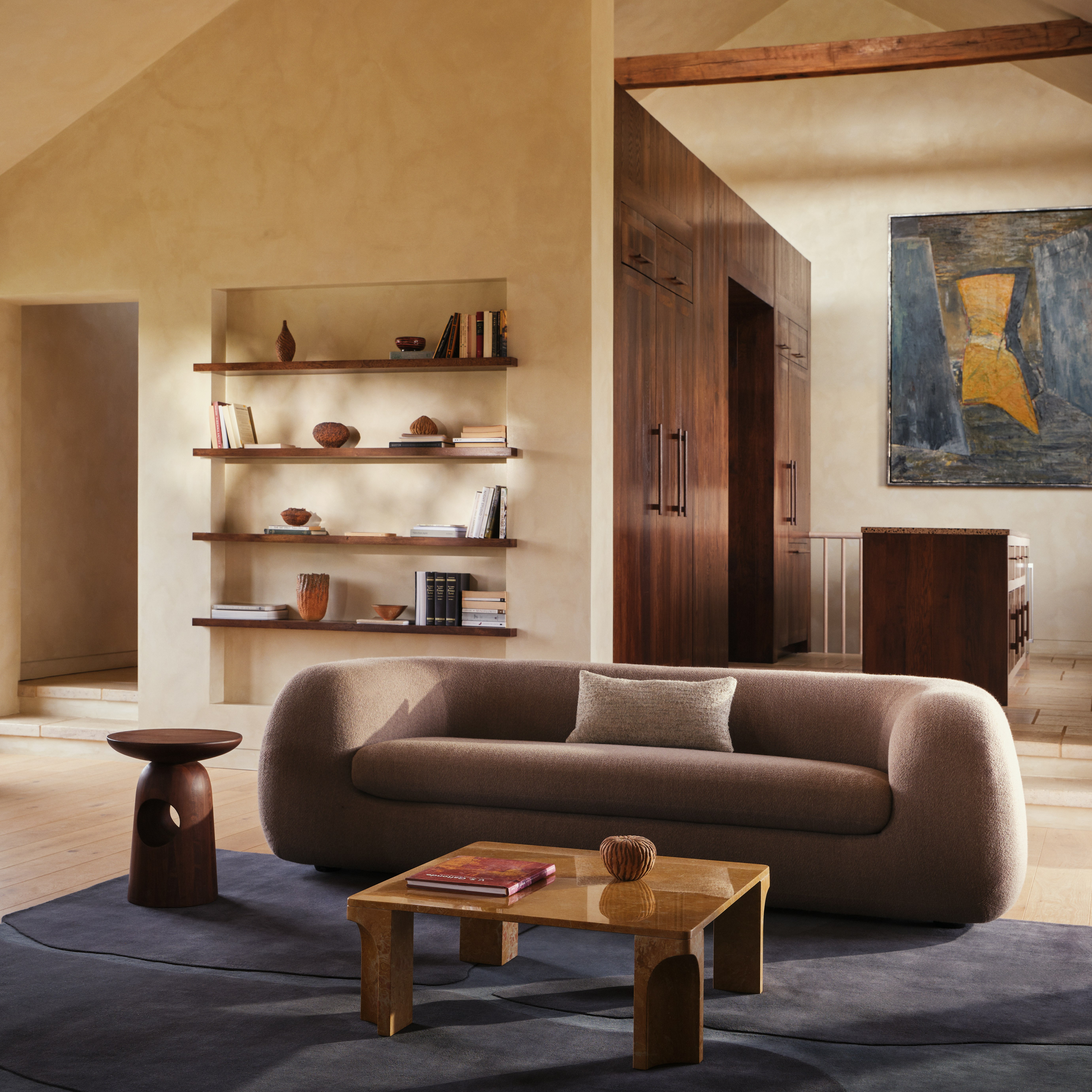 Americano Sofa, Doric Coffee Table, and Eames Lounge in a living room