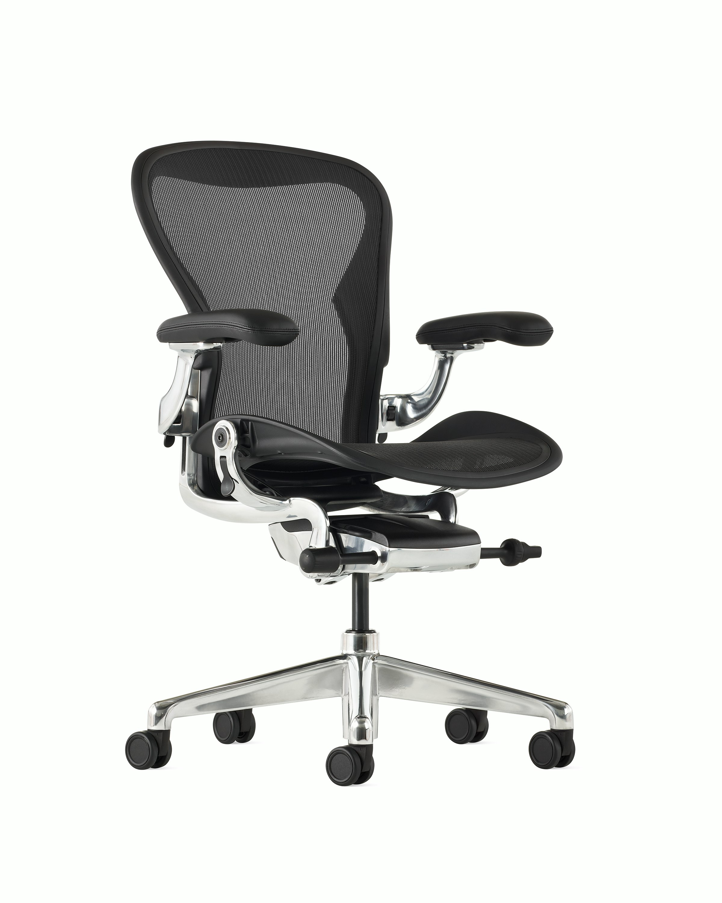 Black matte Aeron Chair on a white background with a polished aluminum 5-star base, chassis, and ergonomic back support, angled view of chair front.