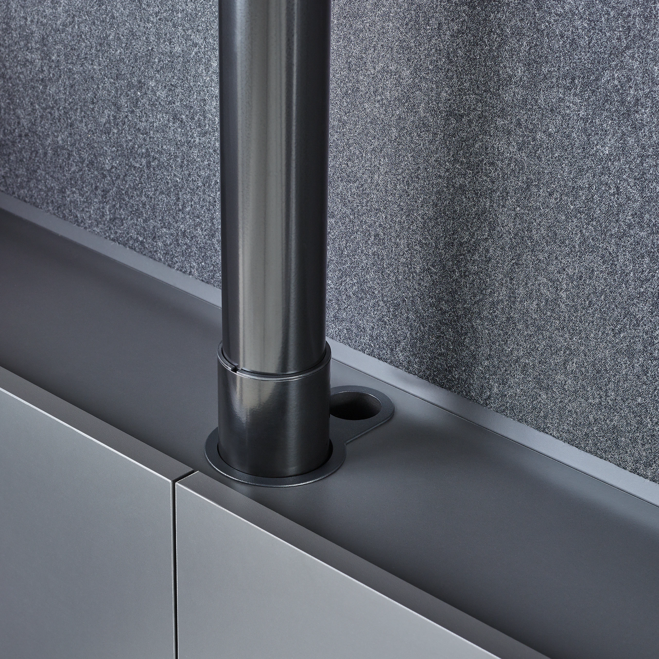 A close-up of the height-adjustment mechanism in Geiger One Casegoods.