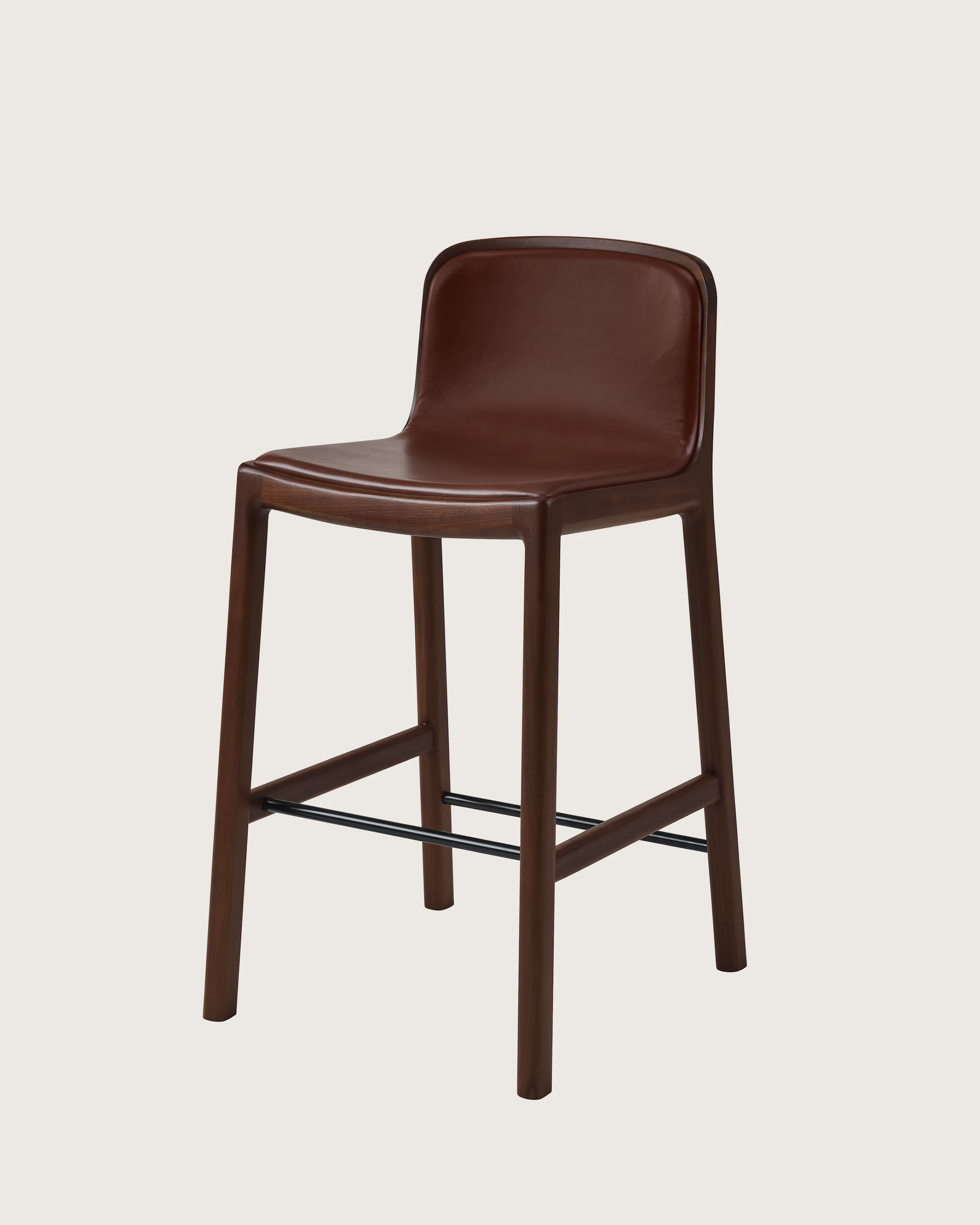Lijn Stool by Carole Baijings for Geiger in Persian Walnut frame upholstered with Maharam Hue Leather in Bittersweet, angled front view on a white sweep.