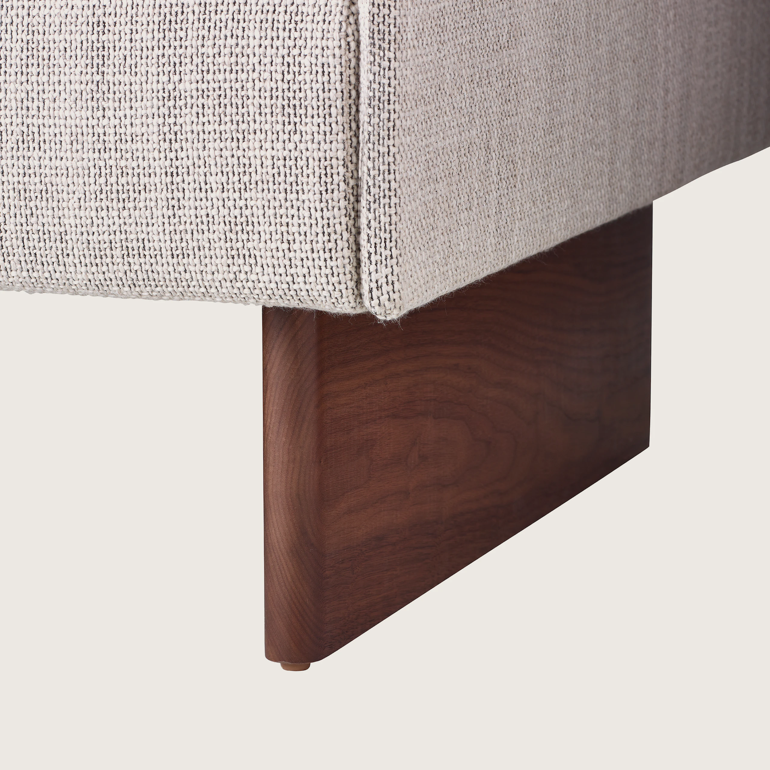 Mantle Lounge Seating in Capri Stone with Walnut Base, detail of base.