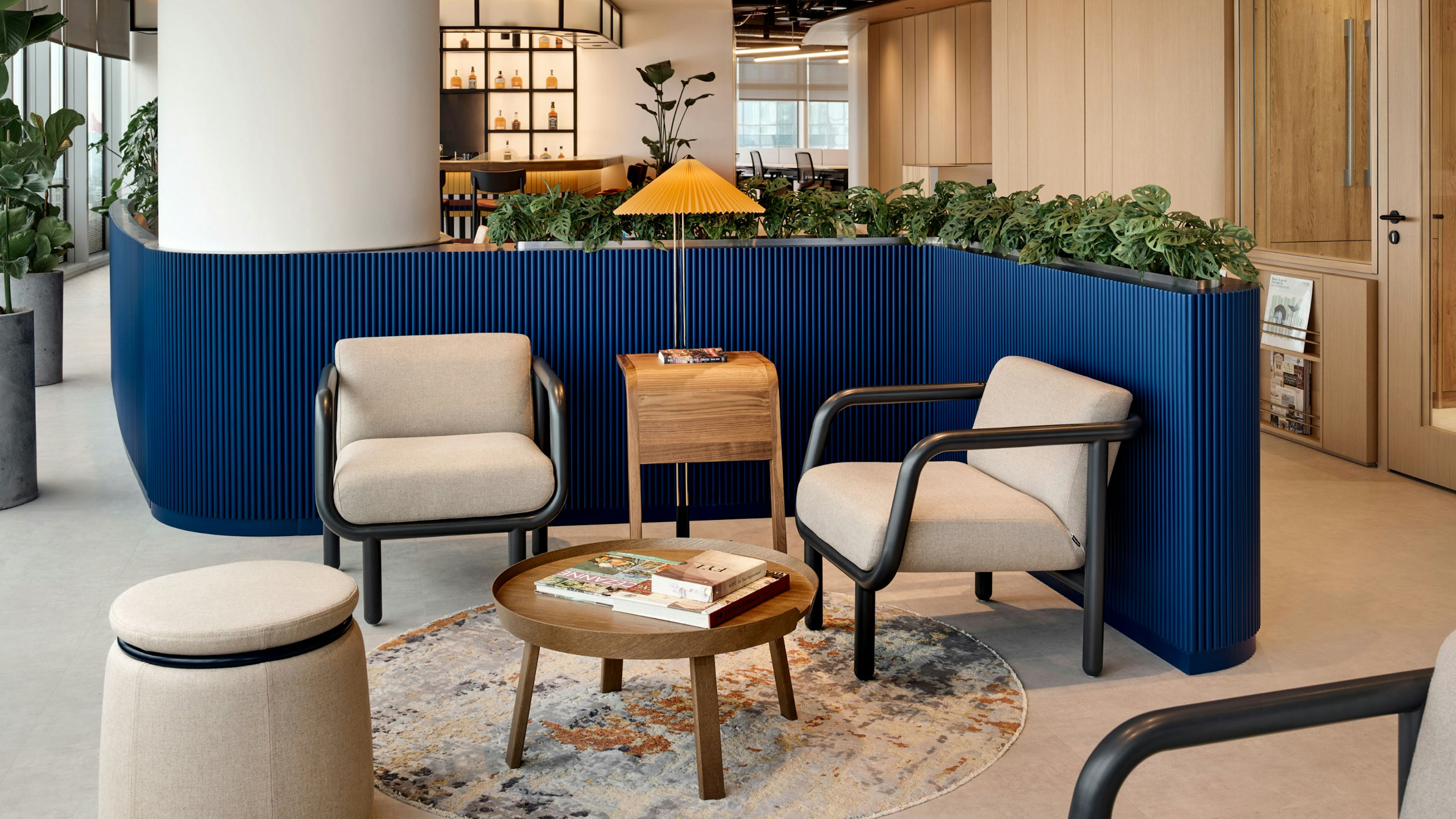 Lounge area with Percy Chairs, Lasso, Around Table and Matin Floor lamp