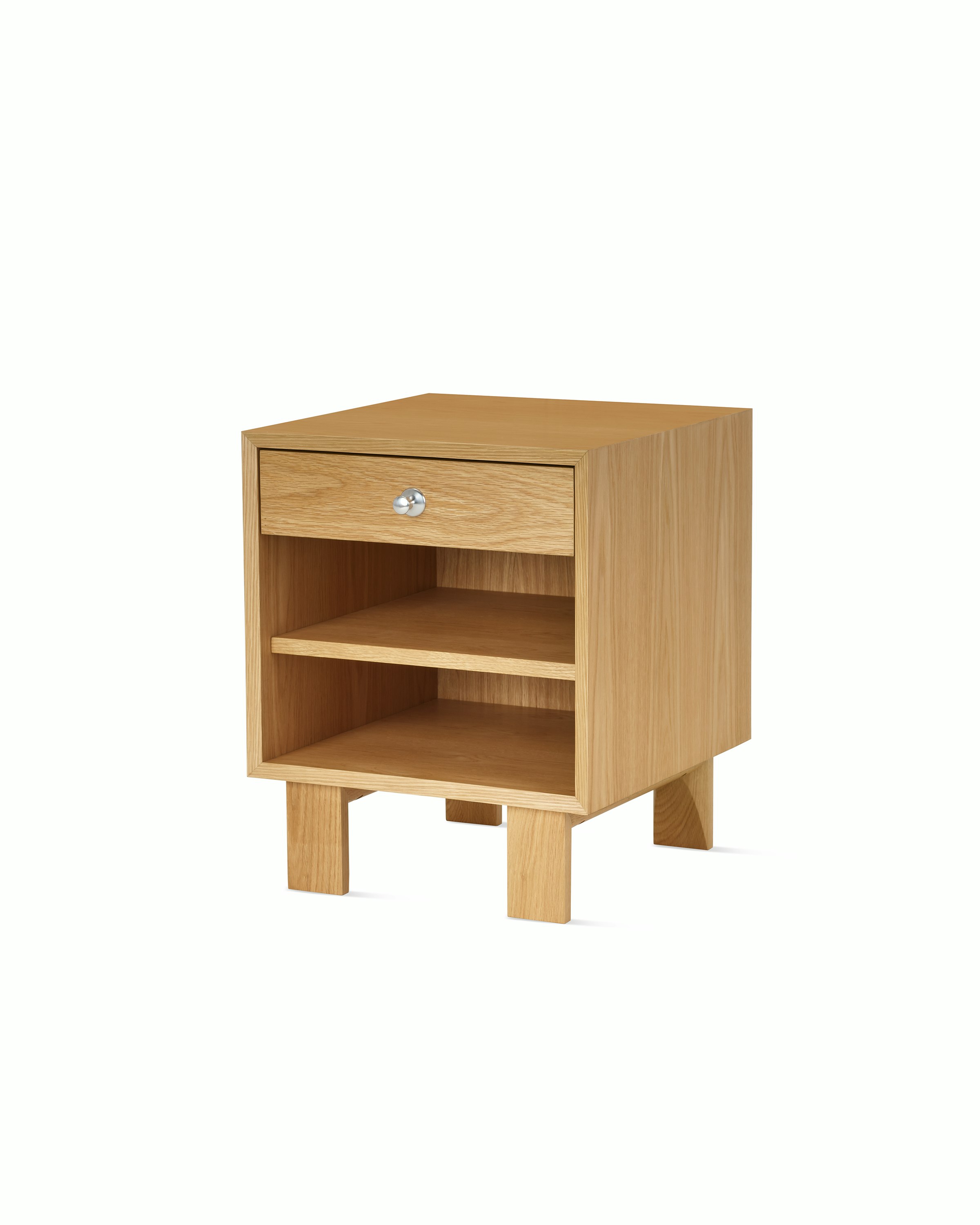 Nelson Basic Cabinet Series Bedside Table with one drawer, aluminum pull, open shelf, standard square legs, in natural oak.