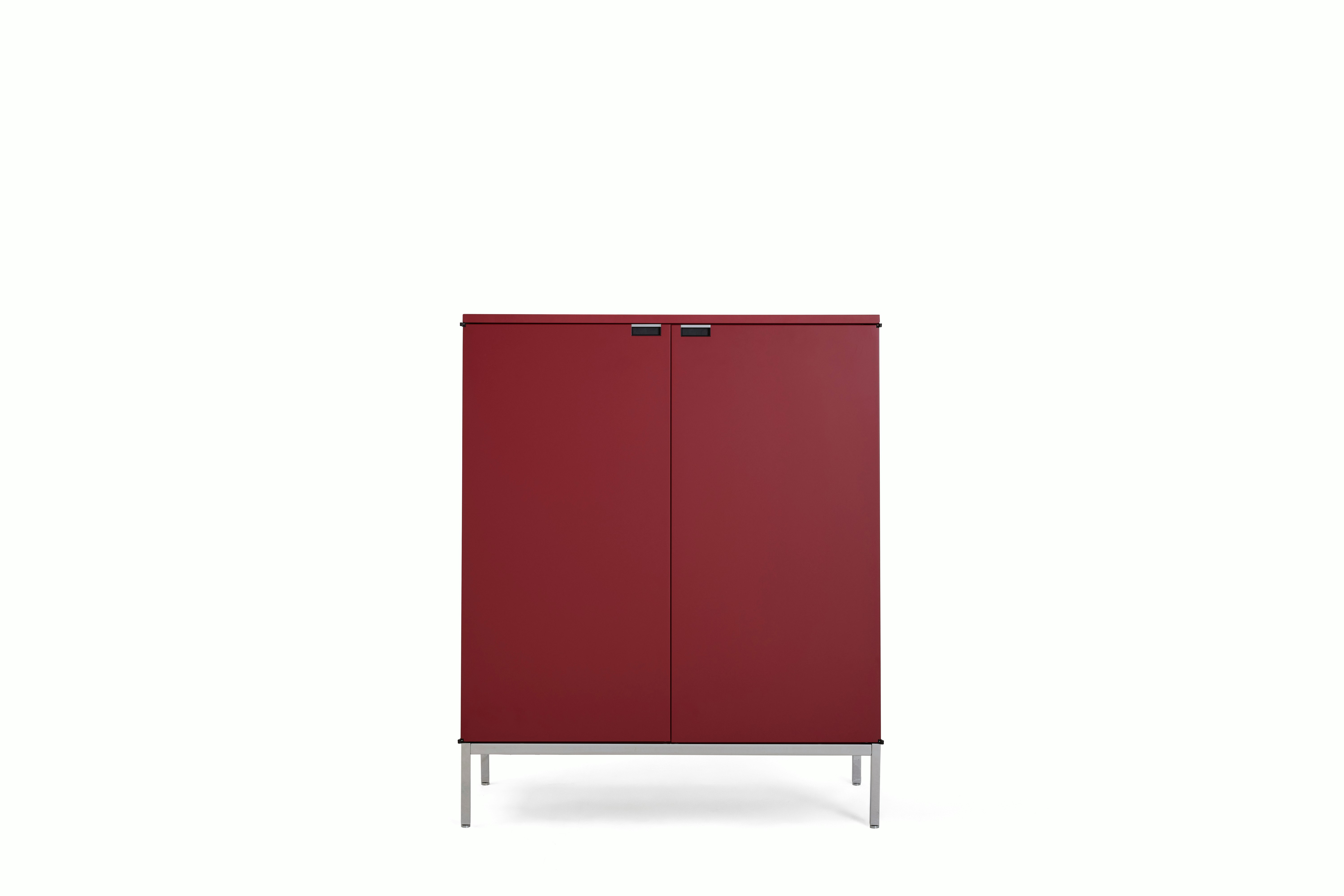 A Florence Knoll Credenza in Tall, Dark Red Lacquer, Lacquer, Dark Red Lacquer viewed from the front.