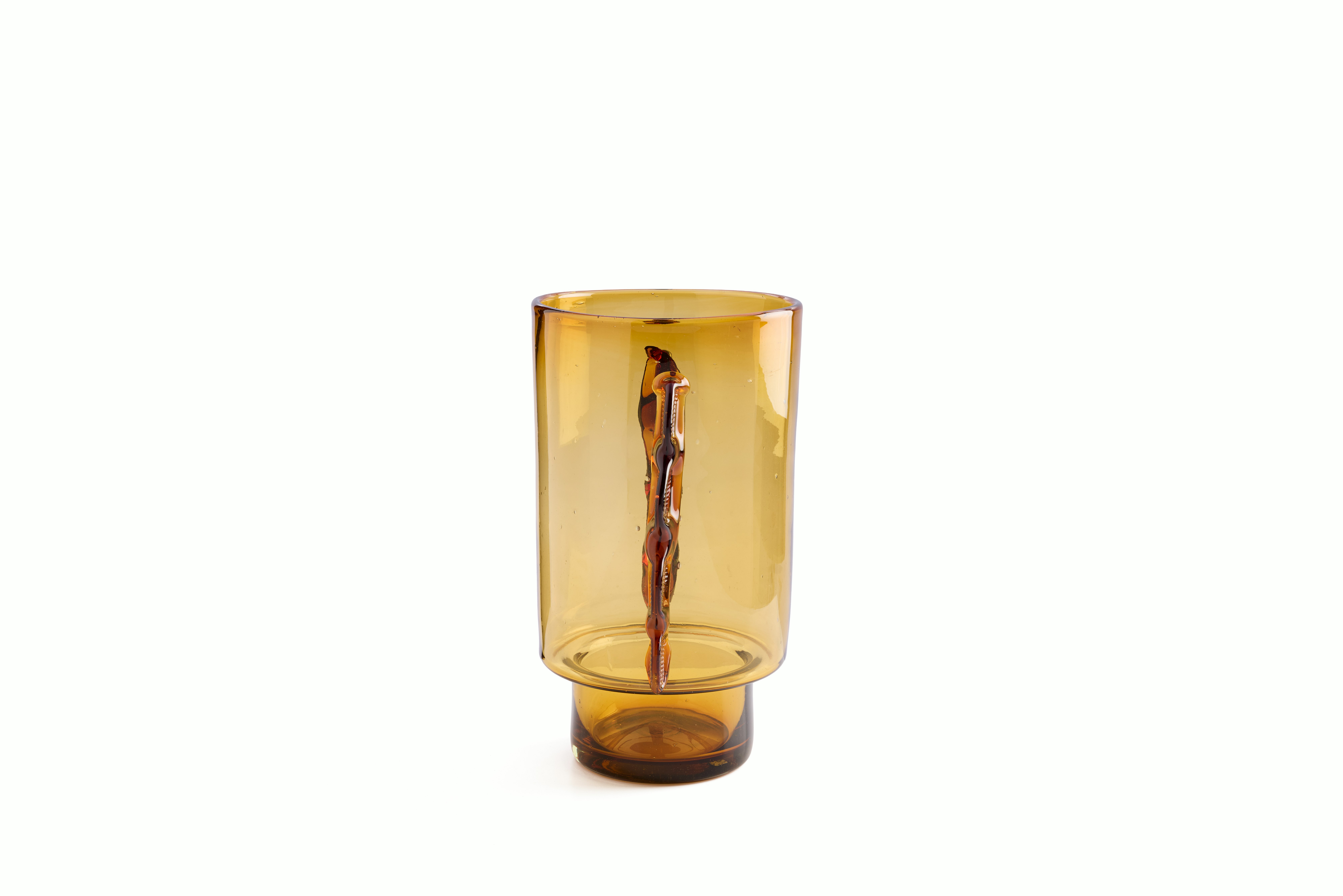 A Nora Vessel in Amber viewed from the side.