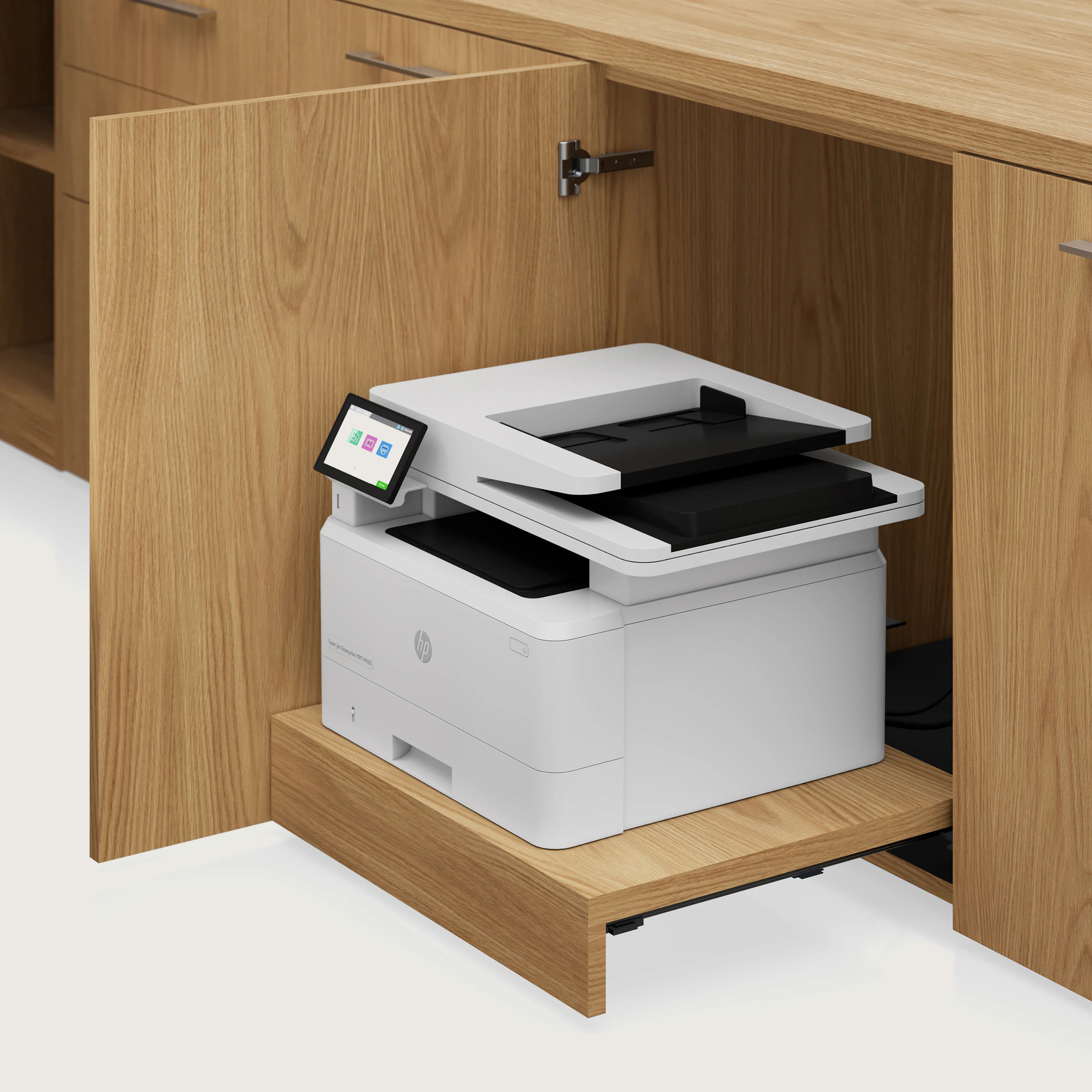 Detail shot of the Geiger One Casegoods printer drawer in Natural Flat Cut Oak viewed from an angle.