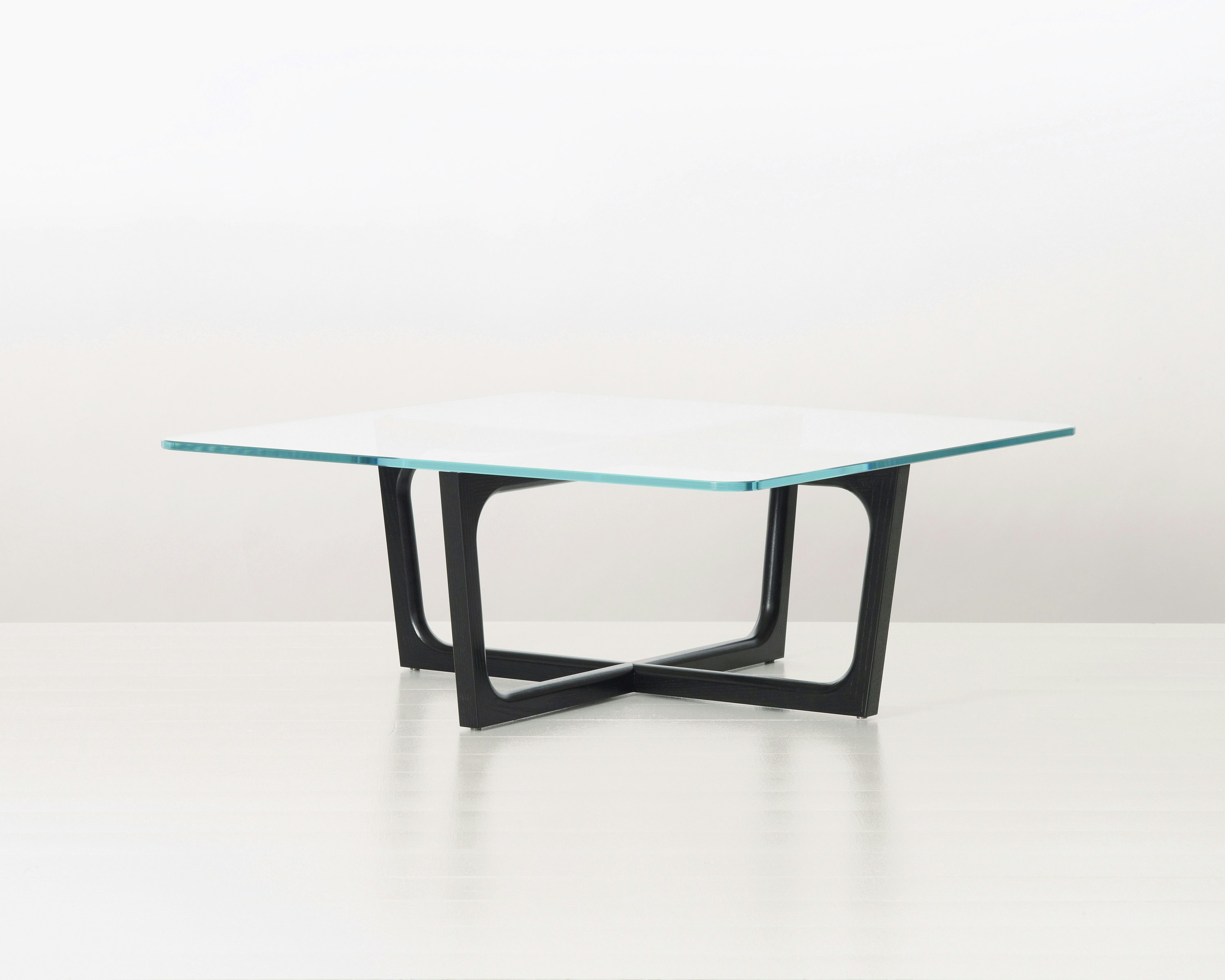 A square Loophole coffee table with a glass top and ebony-ash base.