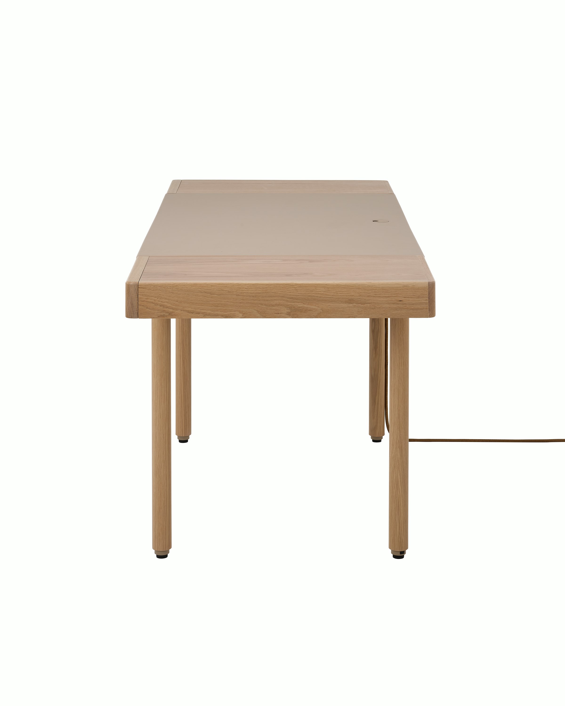 New Canaan Leatherwrap Sit-to-Stand Desk in Oak and Champagne Leather, two drawers, with cord, side view.