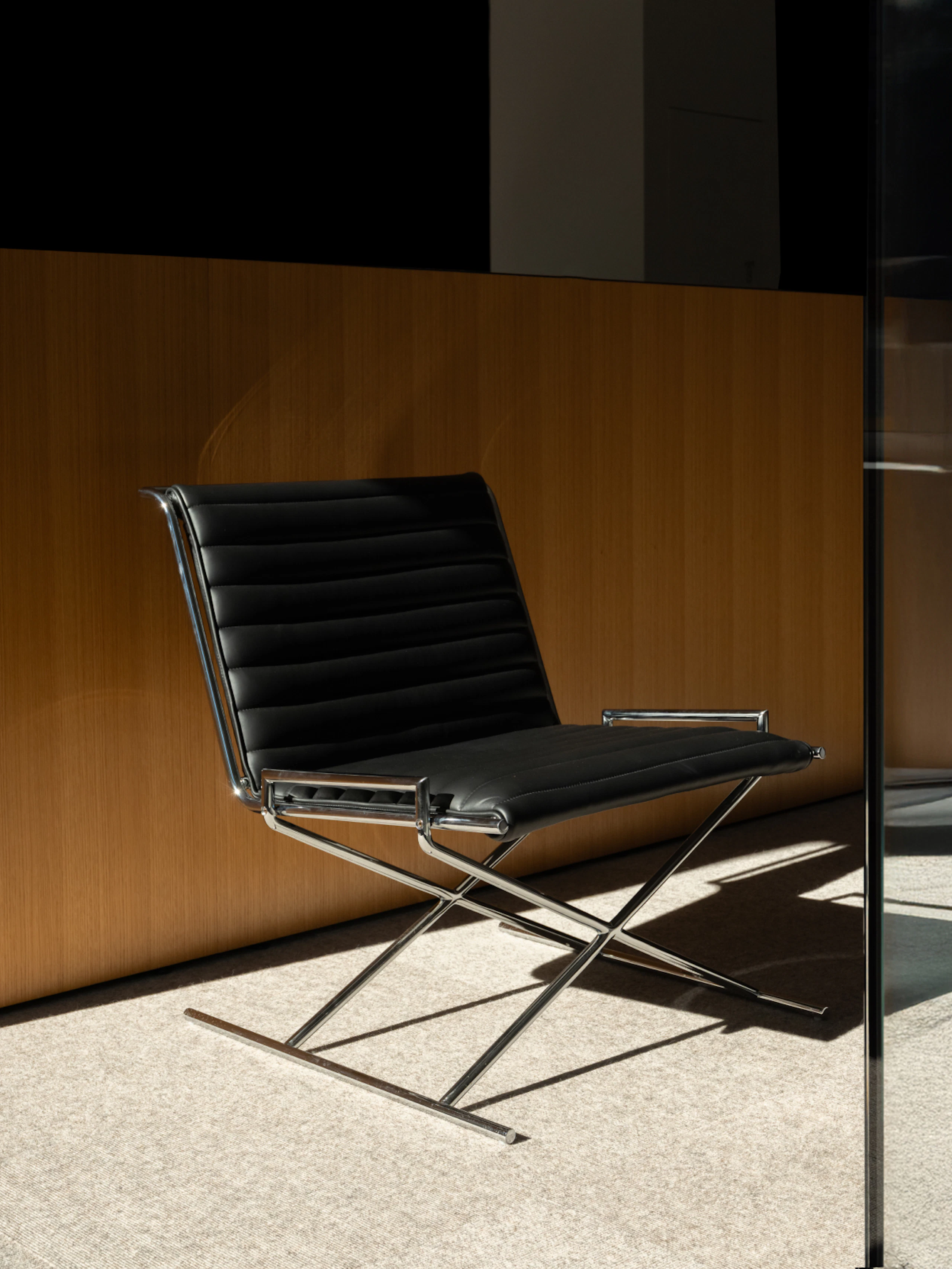 Sled Chair with chrome base and black leather seat and back