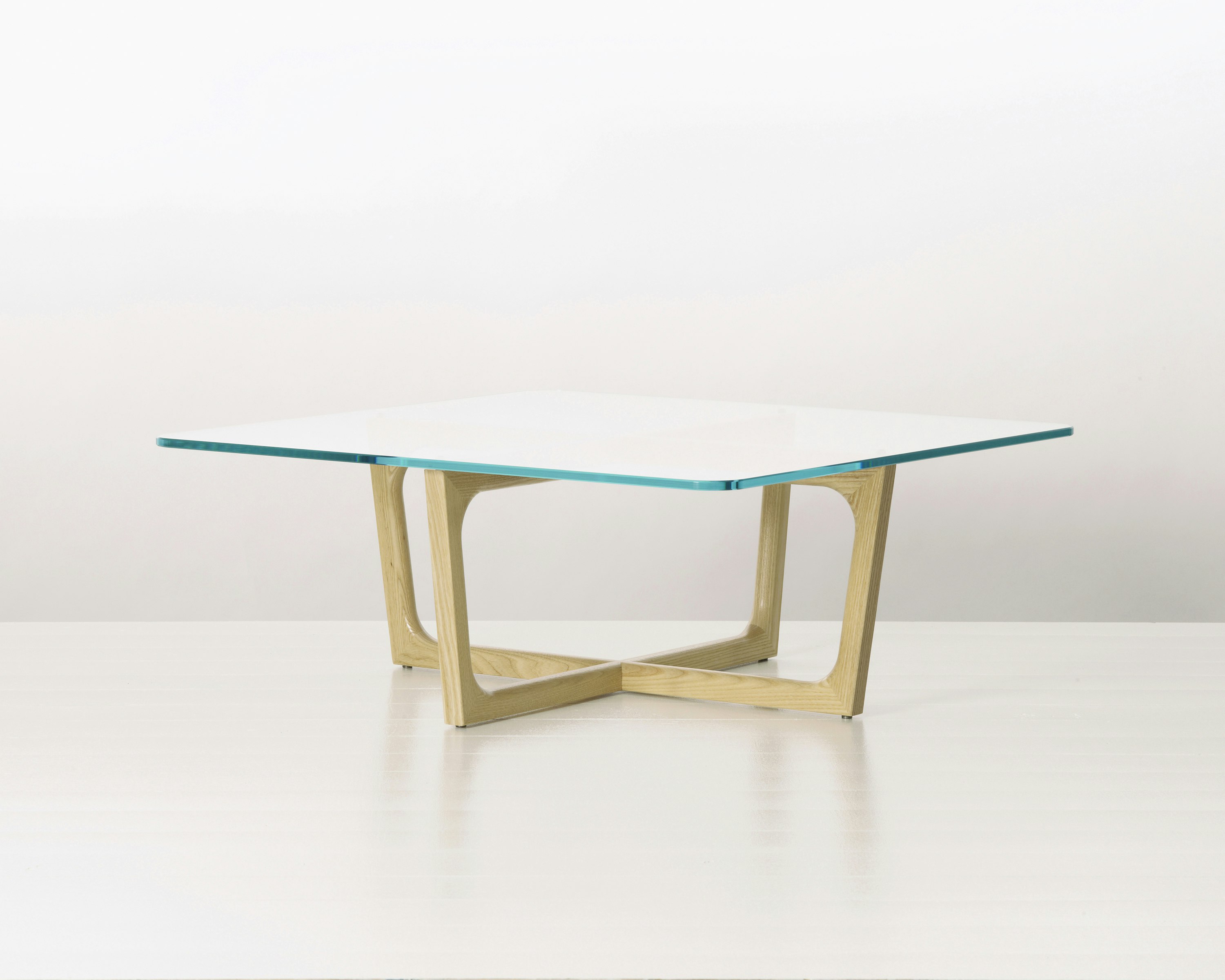 A square Loophole coffee table with a glass top and light-ash base.
