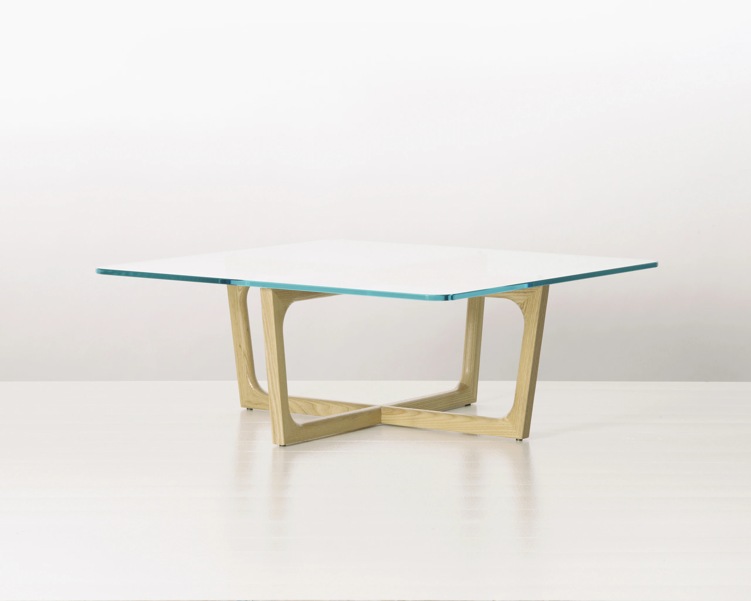 A square Loophole coffee table with a glass top and light-ash base.