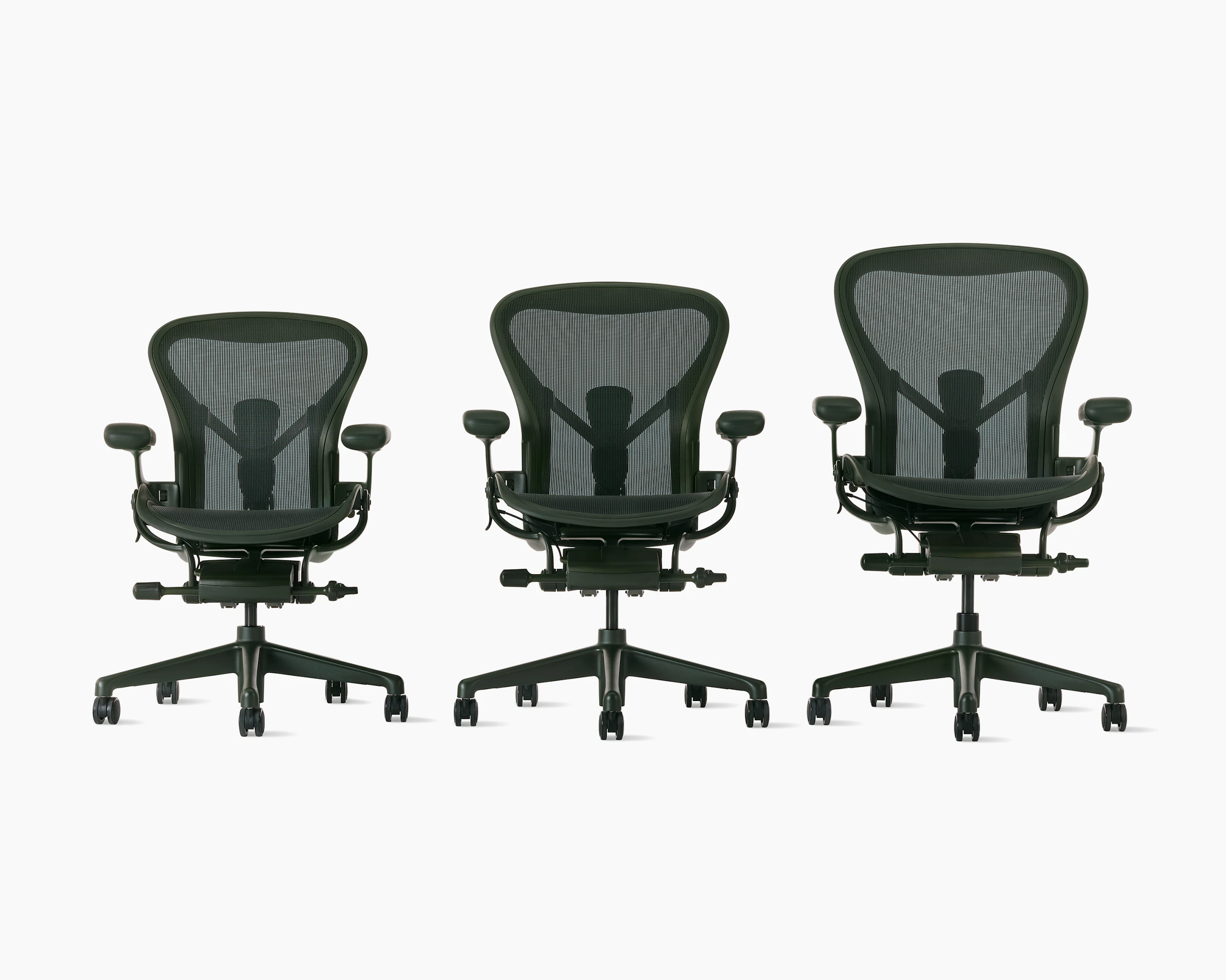 Three Aeron chairs in green in ascending size order A, B and C.